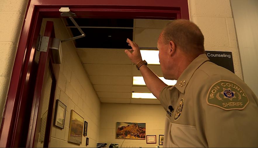 Sheriff Ken Carpenter shows some of the damage Thursday's flash flooding caused at the Cedar City jail.