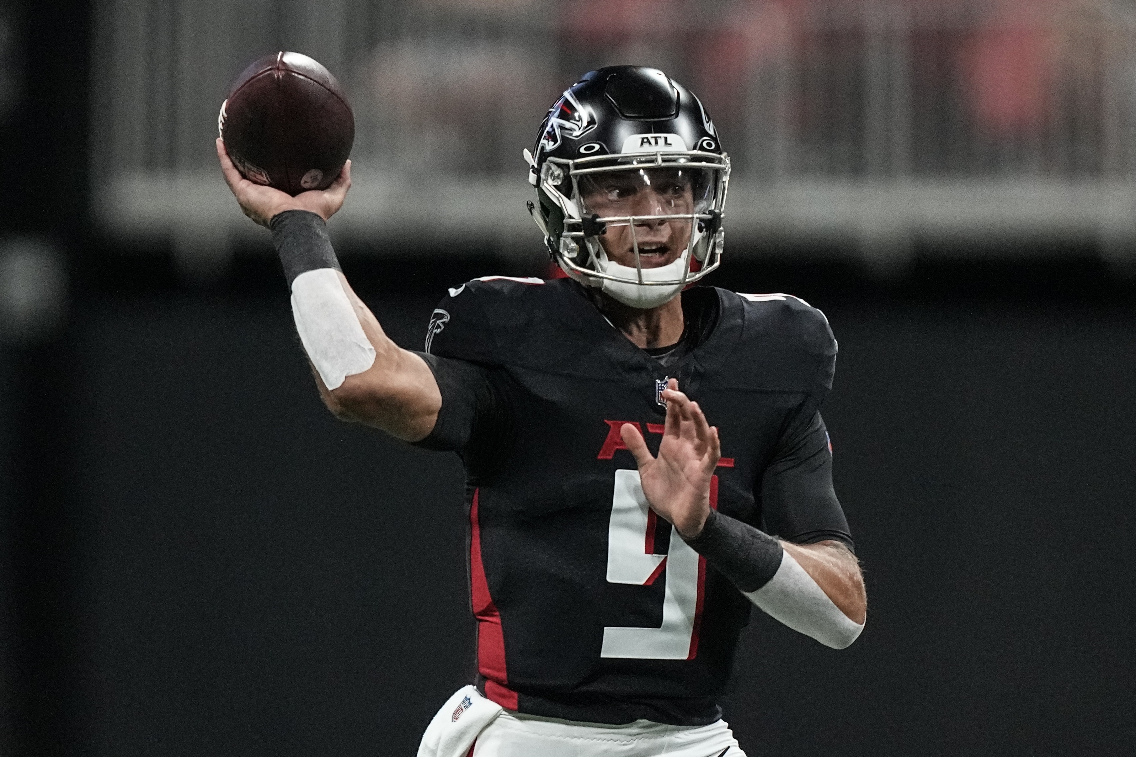 Atlanta Falcons quarterback Desmond Ridder (9) works against the Cincinnati Bengals during the first half of an NFL preseason football game, Friday, Aug. 18, 2023, in Atlanta.
