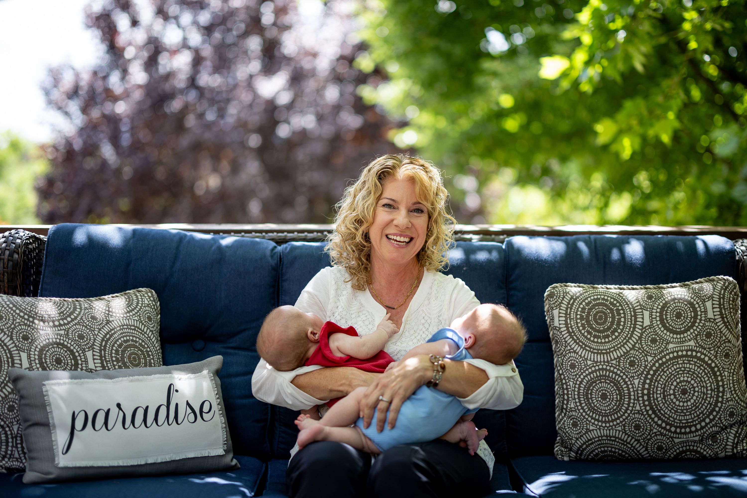 Cindy Davis poses for a photo with her twin 9-week-old granddaughters Indy and Oakley while babysitting them at her home in Cedar Hills on Tuesday. Grandparenting can boost grandkids’ sense of security and help grandparents live happier and longer lives, experts say.