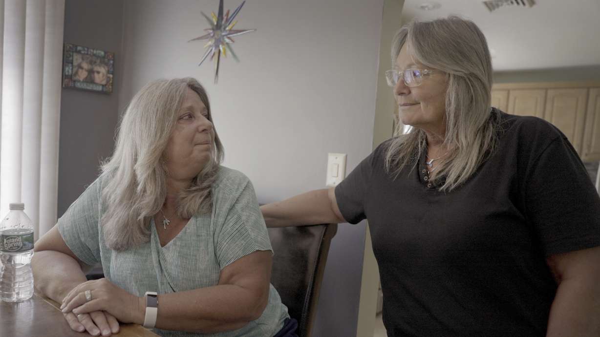 Mary Miller-Duffy, left, sits next to her wife, Sue Duffy, in their home in Newburgh, N.Y., on Aug. 2. Research with her brother-in-law's body has changed Sue's outlook on organ donation. “Maybe I don’t need all my organs when I go to heaven,” she says. “Before I was a hard no. ... Now I’m a hard yes.”