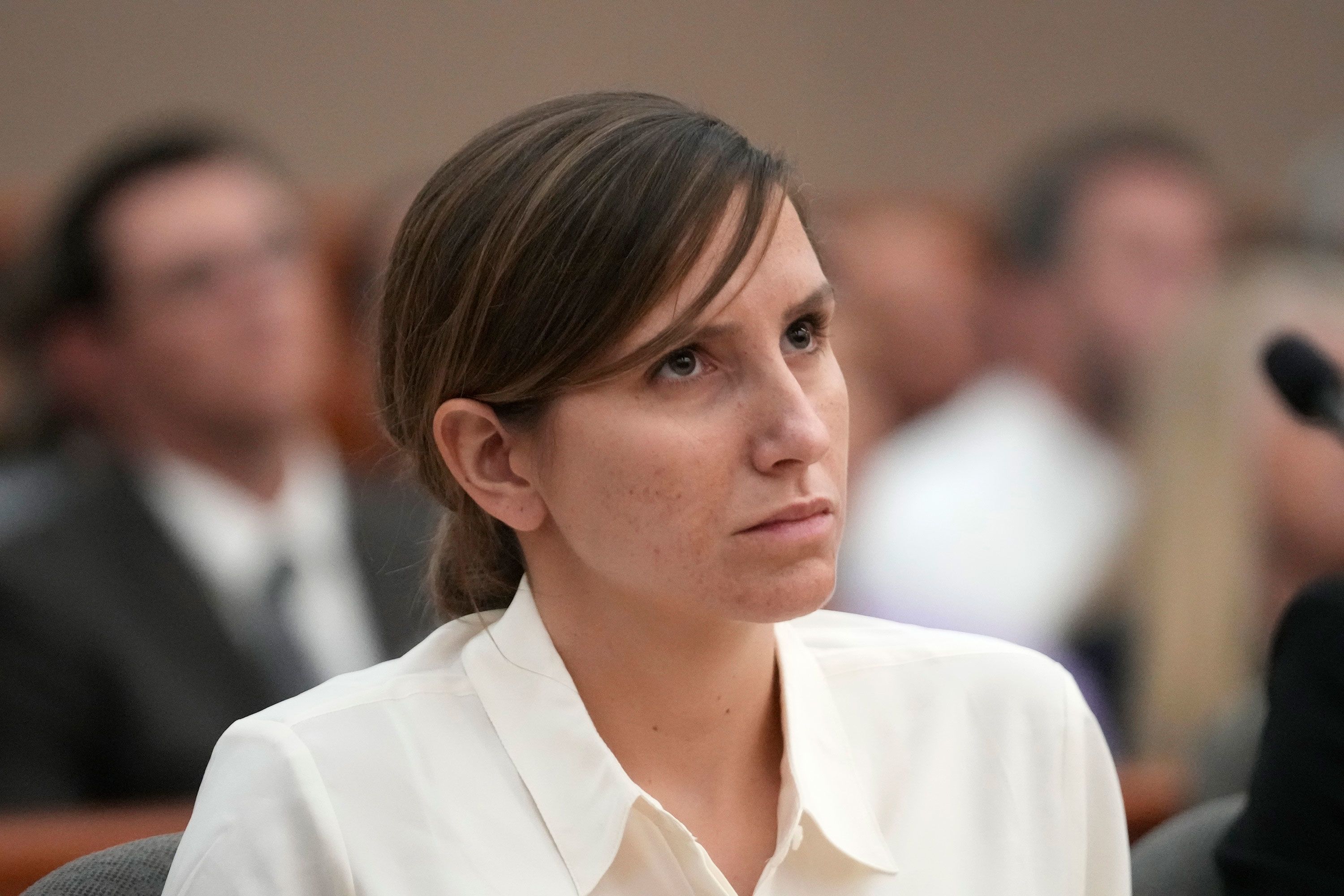 Kouri Richins looks on during a hearing in Park City. Prosecutors in Summit County are calling a request from Richins' attorneys to reopen the questioning of witnesses before moving on in the murder case "a cheap litigation trick."