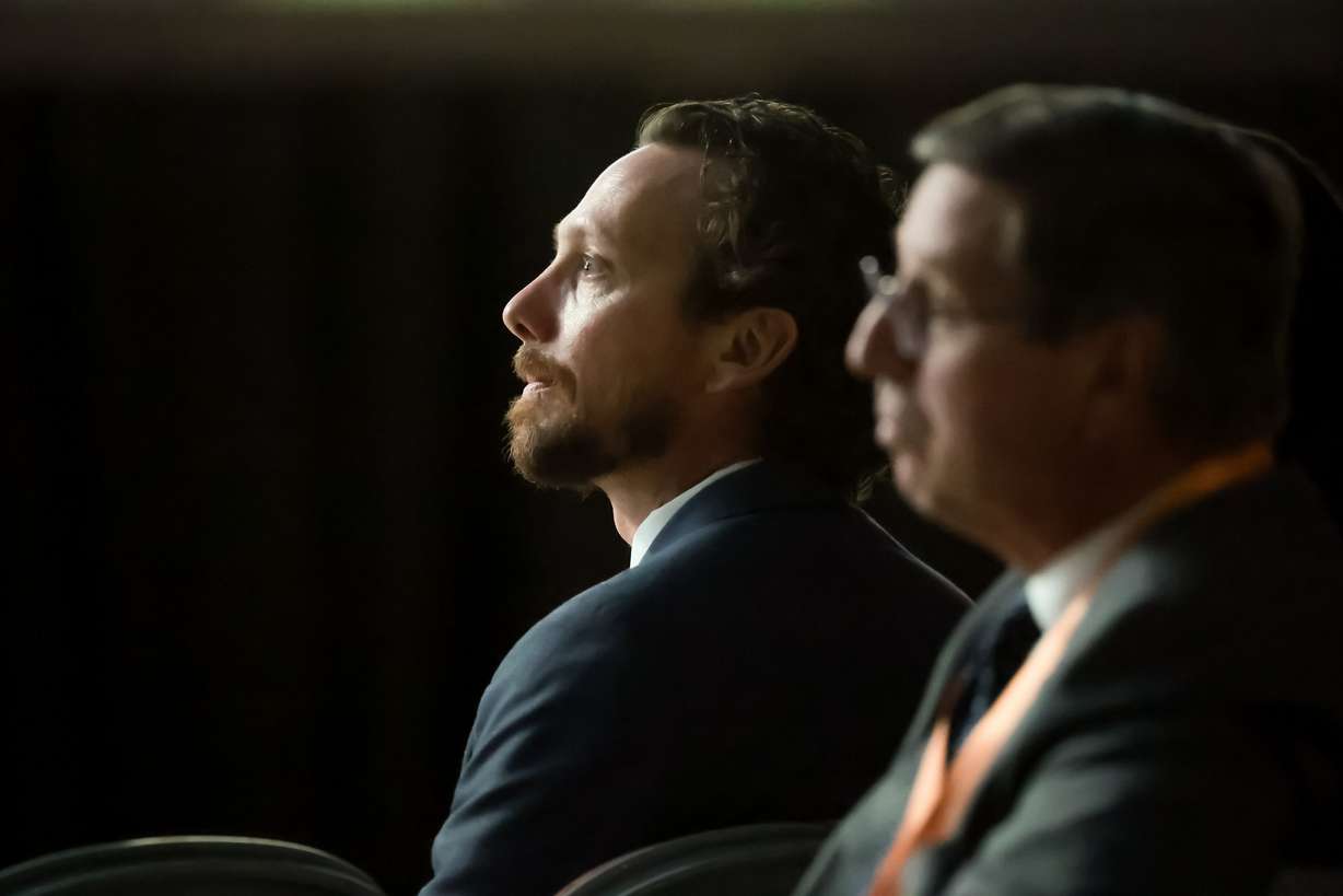 Jason Love listens as his wife, former Utah congresswoman Mia Love, speaks at the Together in Christ Utah YSA Conference at the Salt Palace in Salt Lake City on Saturday.