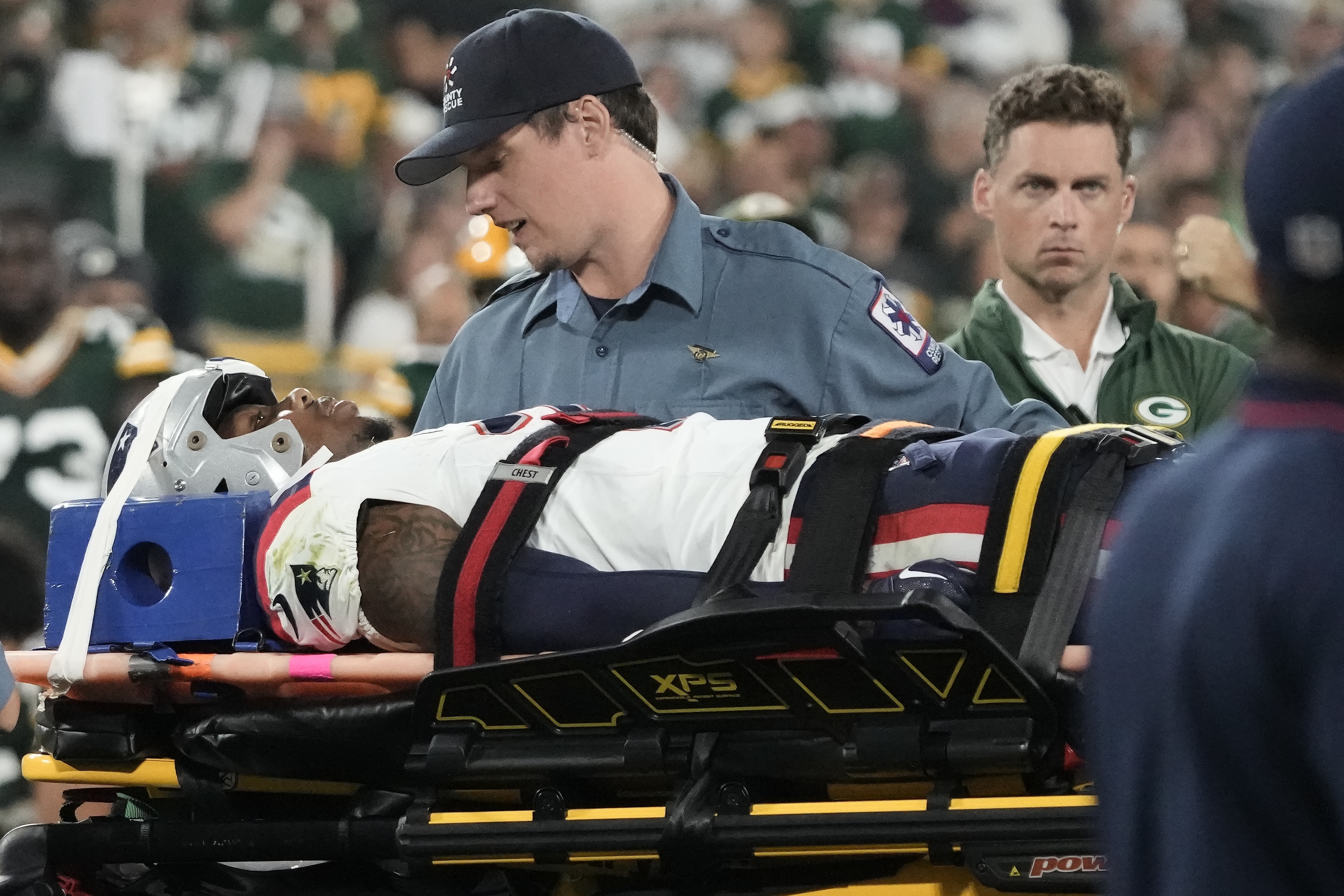New England Patriots cornerback Isaiah Bolden is brought off the field after being injured during the second half of the team's preseason NFL football game against the Green Bay Packers, Saturday, Aug. 19, 2023, in Green Bay, Wis. The game was suspended.