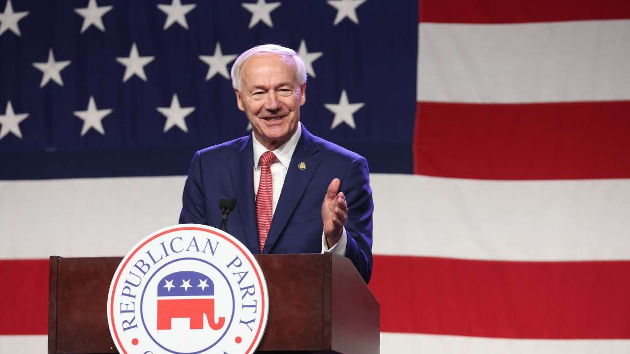 Former Arkansas Gov. Asa Hutchinson, a Republican presidential candidate, speaks in Iowa on July 28. He says he has qualified for the first GOP presidential debate.