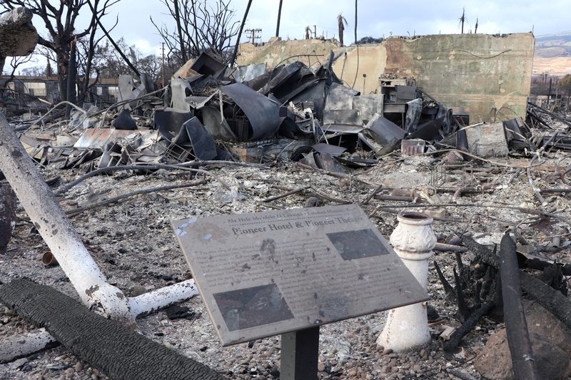 A sign at the site of the destroyed Pioneer Hotel and Pioneer Theater is seen after wildfires driven by high winds burned across most of the town in Lahaina, Maui, Hawaii, Aug. 10. 