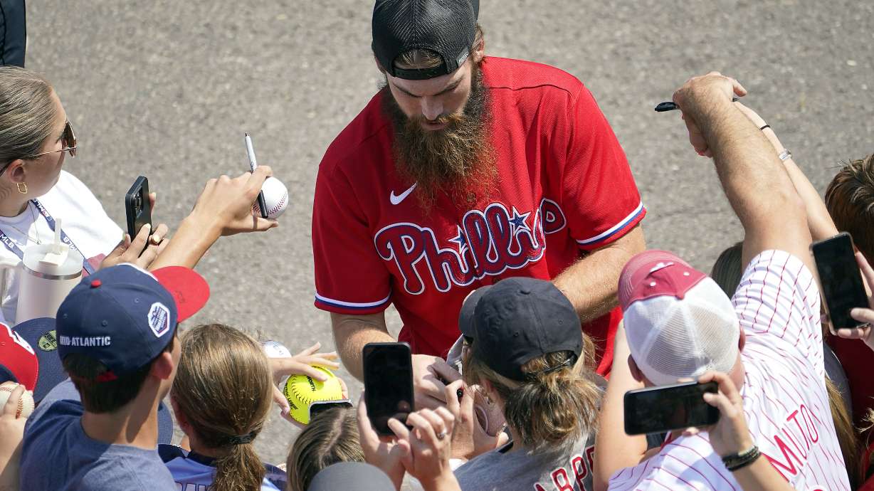 Philadelphia Phillies outfielder Brandon Marsh signs autographs for fans as the team arrived at the Little League World Series Complex to watch the Smithfield, R.I. vs. Media, Pa. baseball game at the Little League World Series tournament in South Williamsport, Pa., Sunday, Aug. 20, 2023.