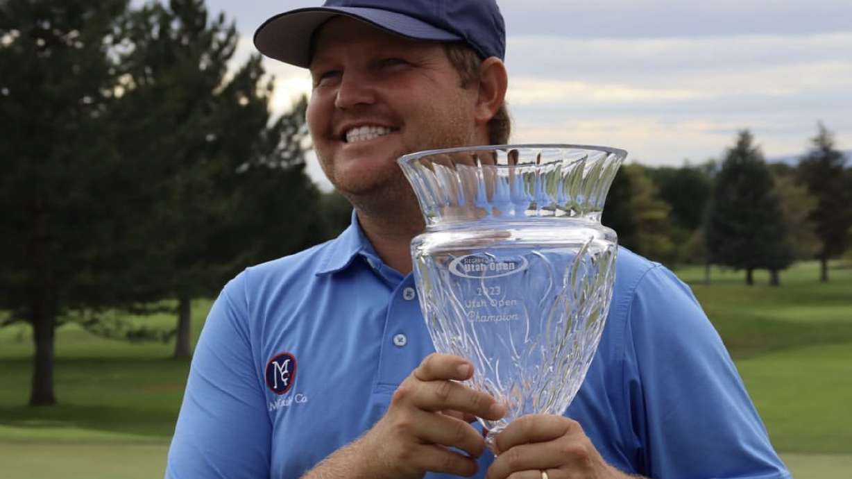 Former BYU golfer Zac Blair holds the trophy after winning the Siegfried and Jensen Utah Open, Saturday, Aug. 19, 2023, at Riverside Country Club in Provo.