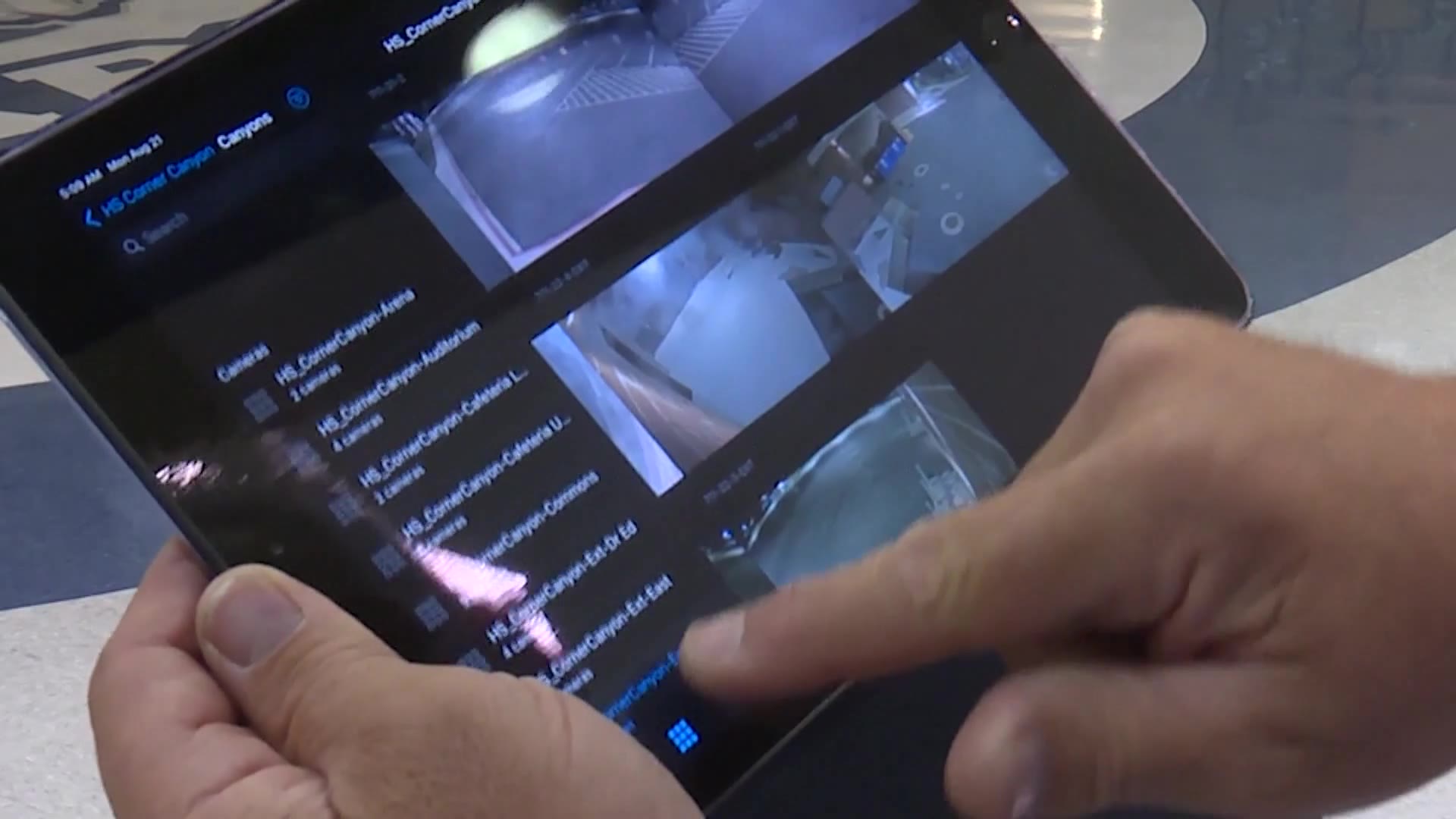 Canyon School District risk manager Ryan Jakeman demonstrates the school’s new hall monitoring system in Draper, Monday.