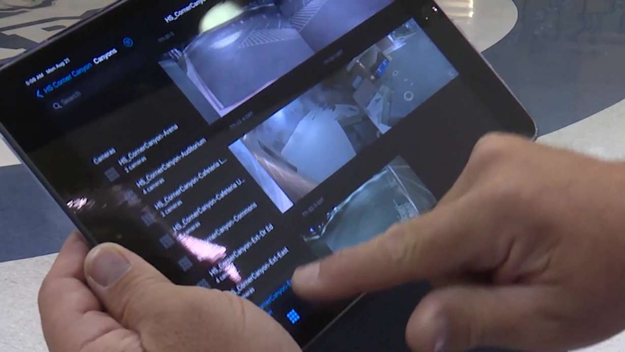 Canyon School District risk manager Ryan Jakeman demonstrates the school’s new hall monitoring system in Draper, Monday.