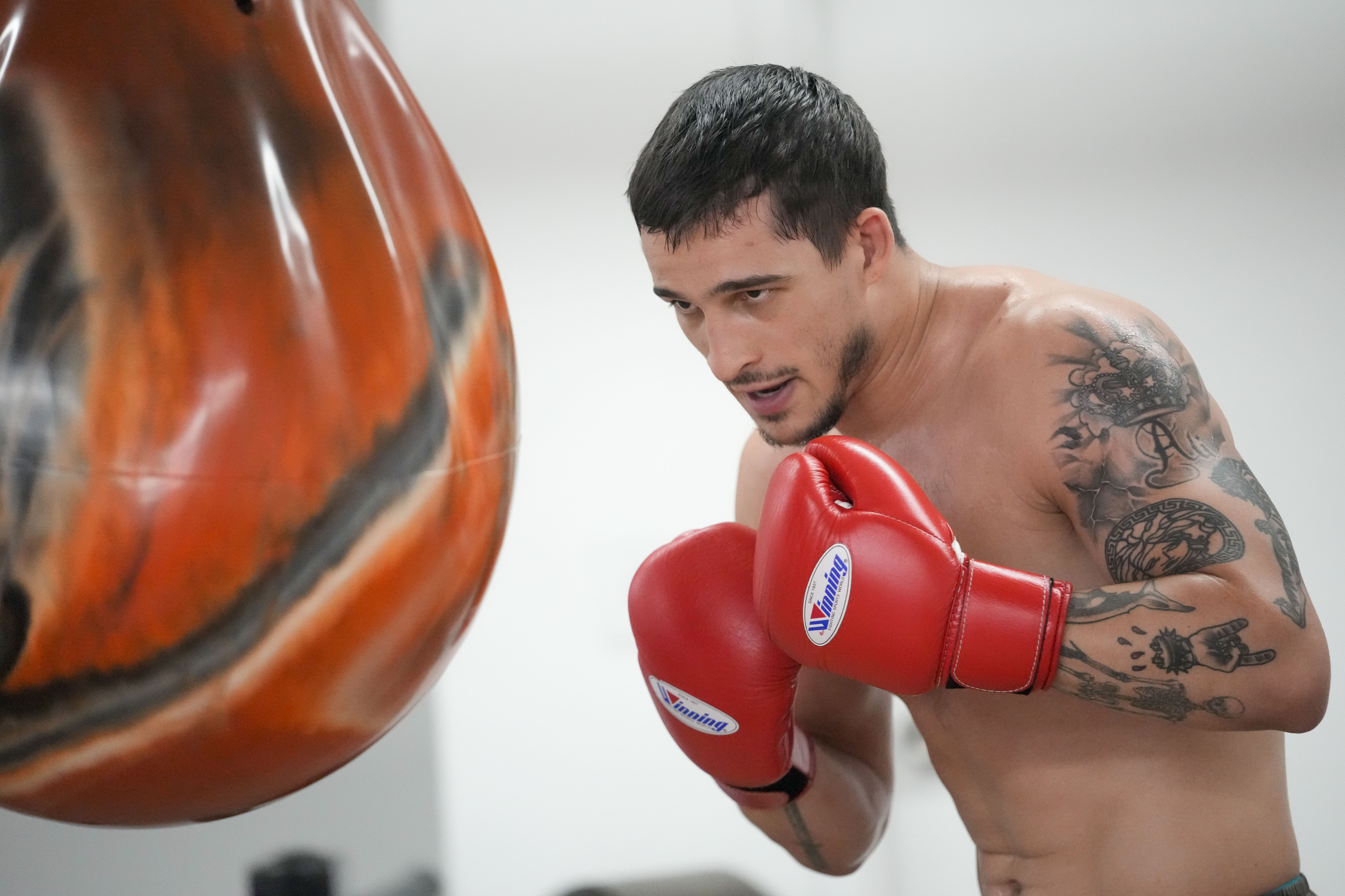 Biaggio Ali Walsh hits a punching bag while training ahead of his return to the Professional Fighters League, Monday, July 24, 2023, in New York. Ali Walsh can't wait to fight, and gets the next chance in his young MMA career Wednesday on a PFL card at Madison Square Garden, where his grandfather participated in some major events.