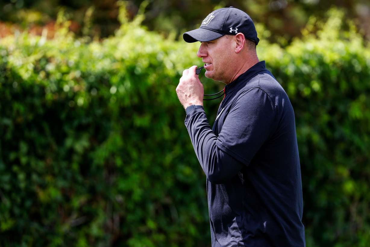 Offensive line coach Jim Harding looks on as his players take part in Utah's fall camp on July 31, 2023.