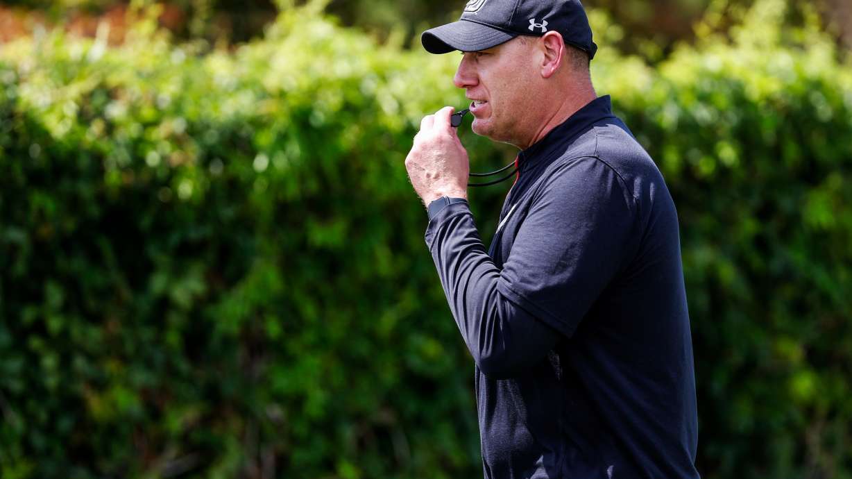 Offensive line coach Jim Harding looks on as his players take part in Utah's fall camp on July 31, 2023.