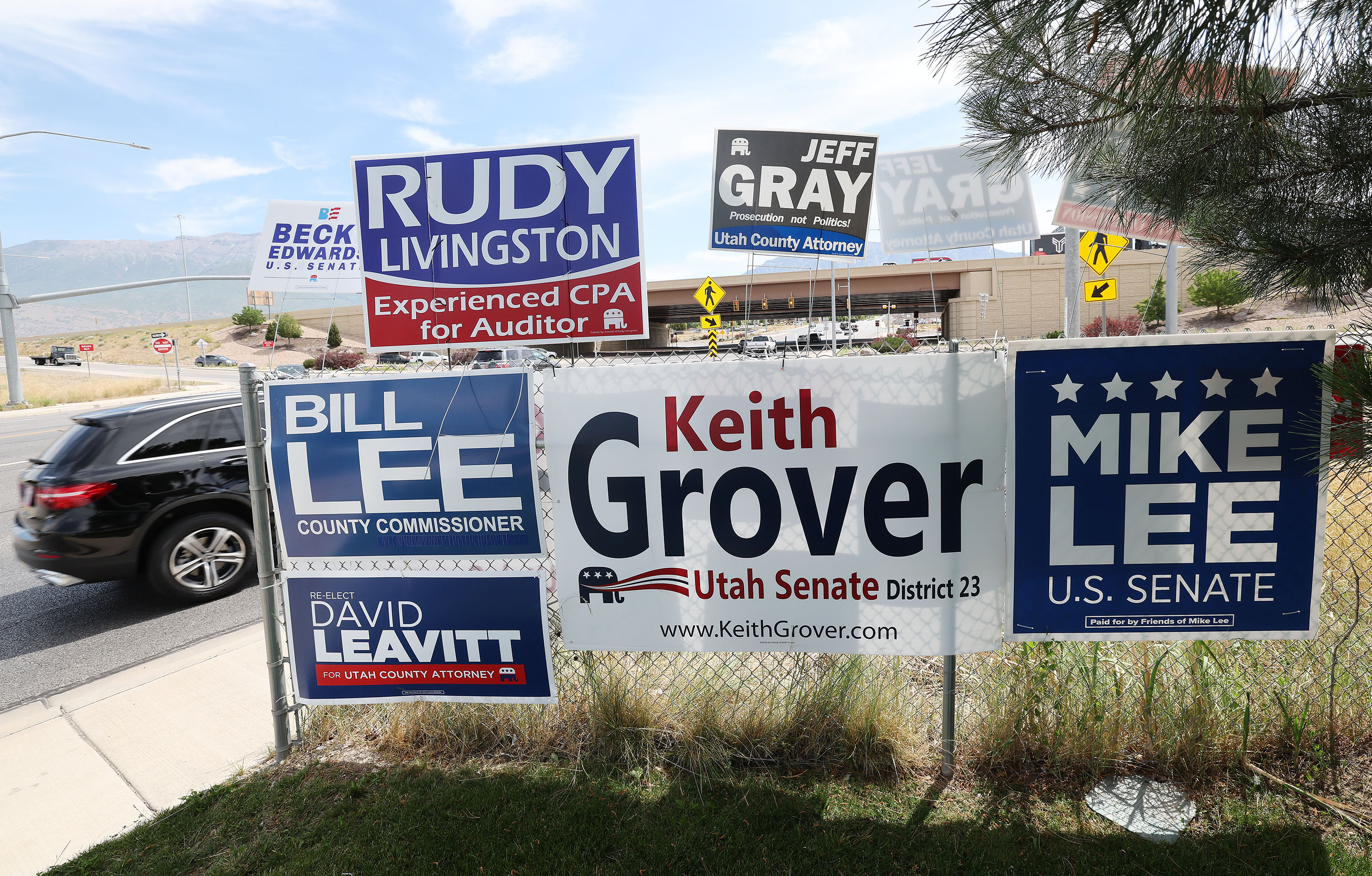 Campaign signs are displayed near I-15 in Orem on June 22, 2022. The Utah Department of Transportation sent a letter to 2023 candidates reminding them to keep signs away from any state rights of way.