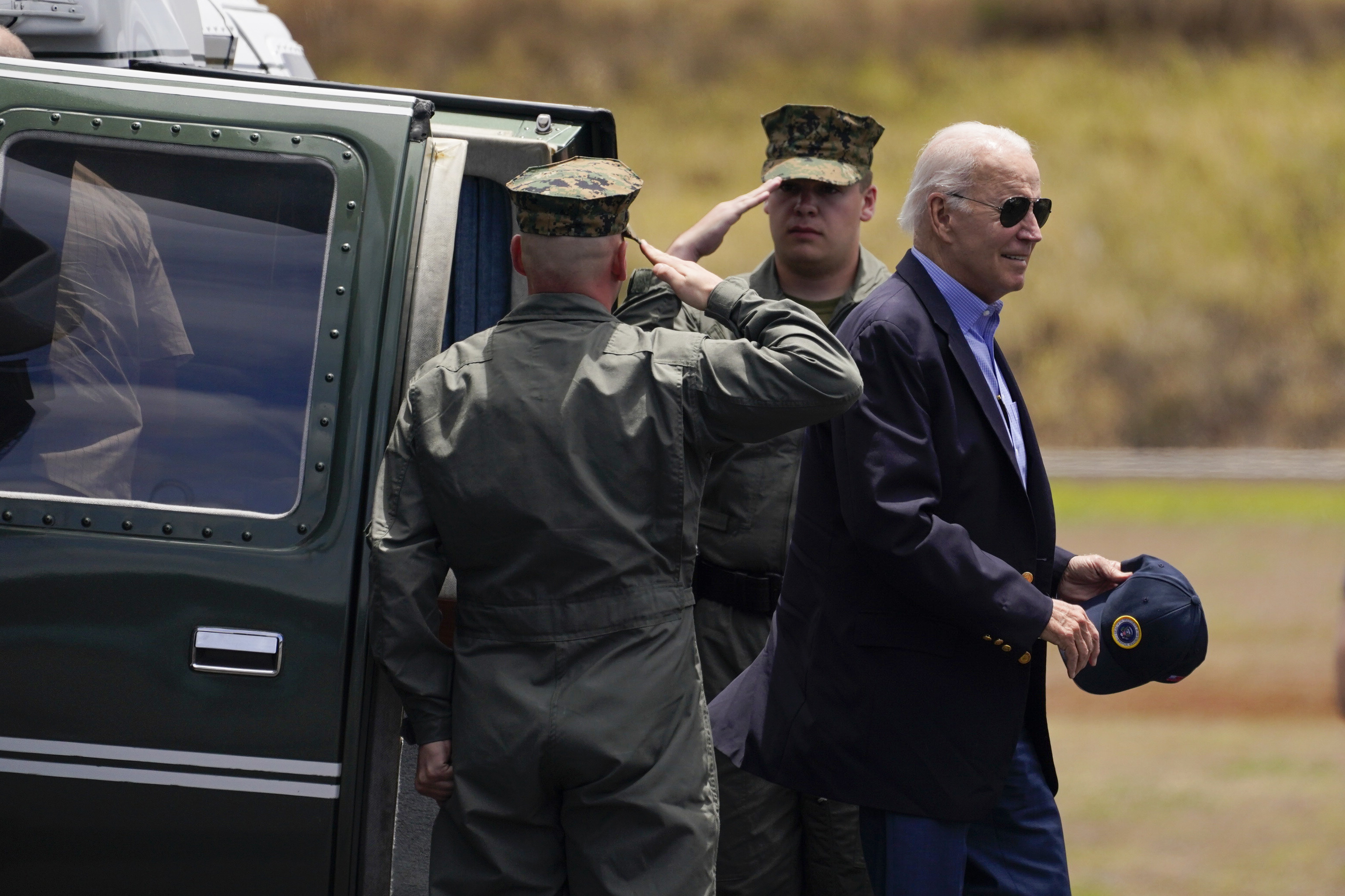 President Joe Biden arrives at Kapalua Airport as he visits areas devastated by the Maui wildfires, Monday, in Lahaina, Hawaii.