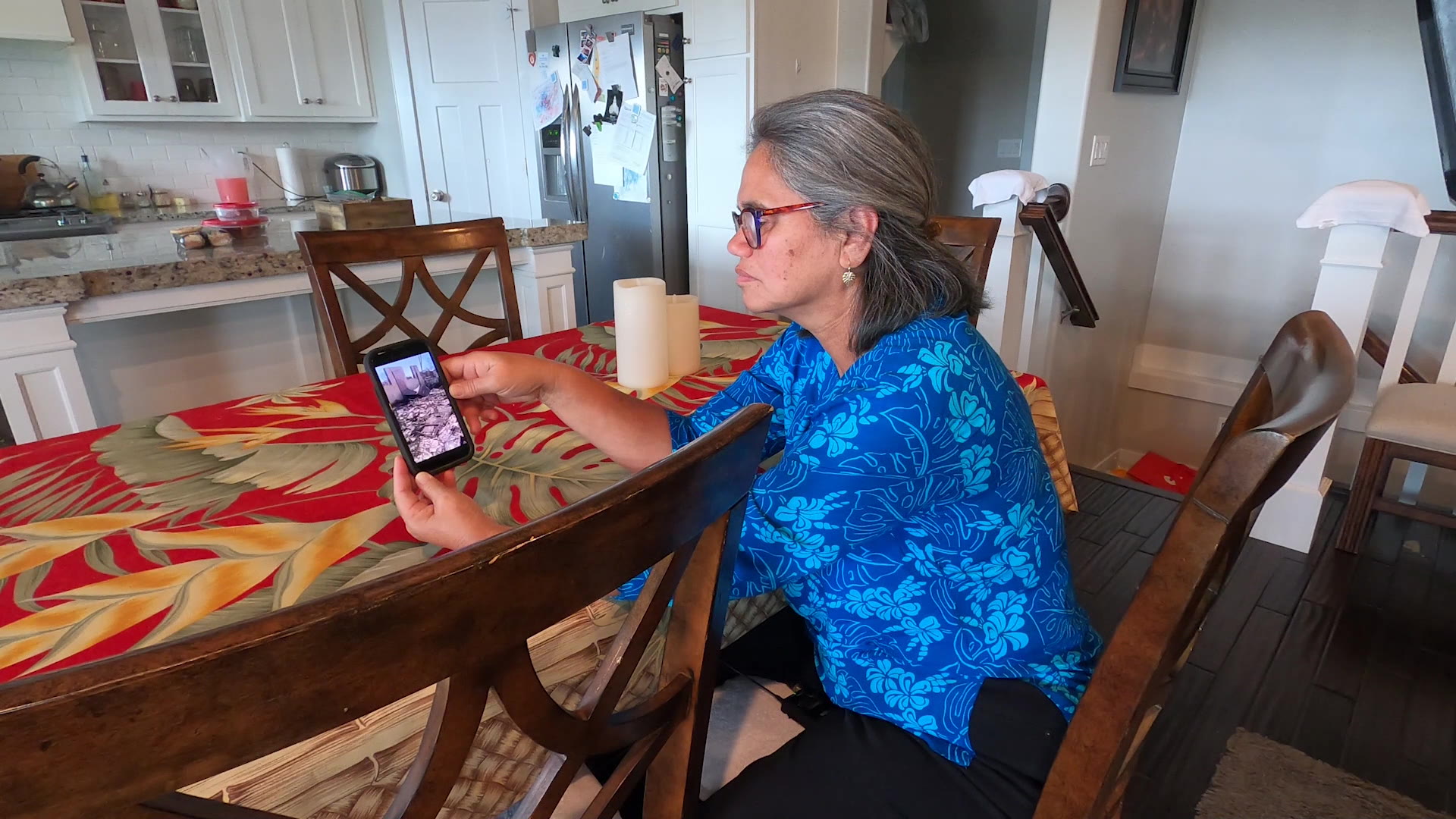 Minette Ngalu looks at the remains of her family compound.