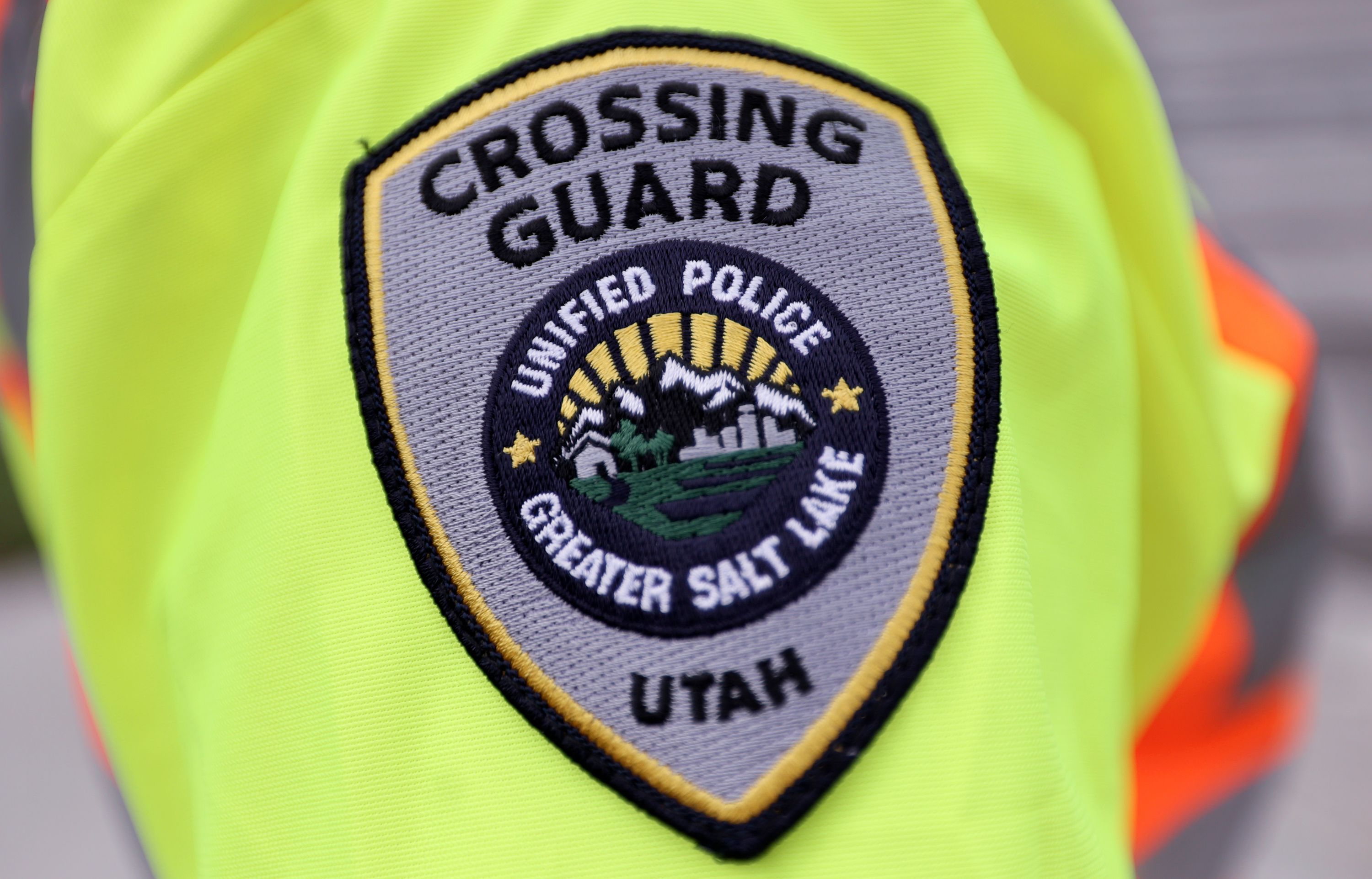 A Unified police crossing guard badge is pictured in Millcreek on Monday. Salt Lake City is looking to fill vacant crossing guard positions and is offering $17 an hour plus a $250 signing bonus.