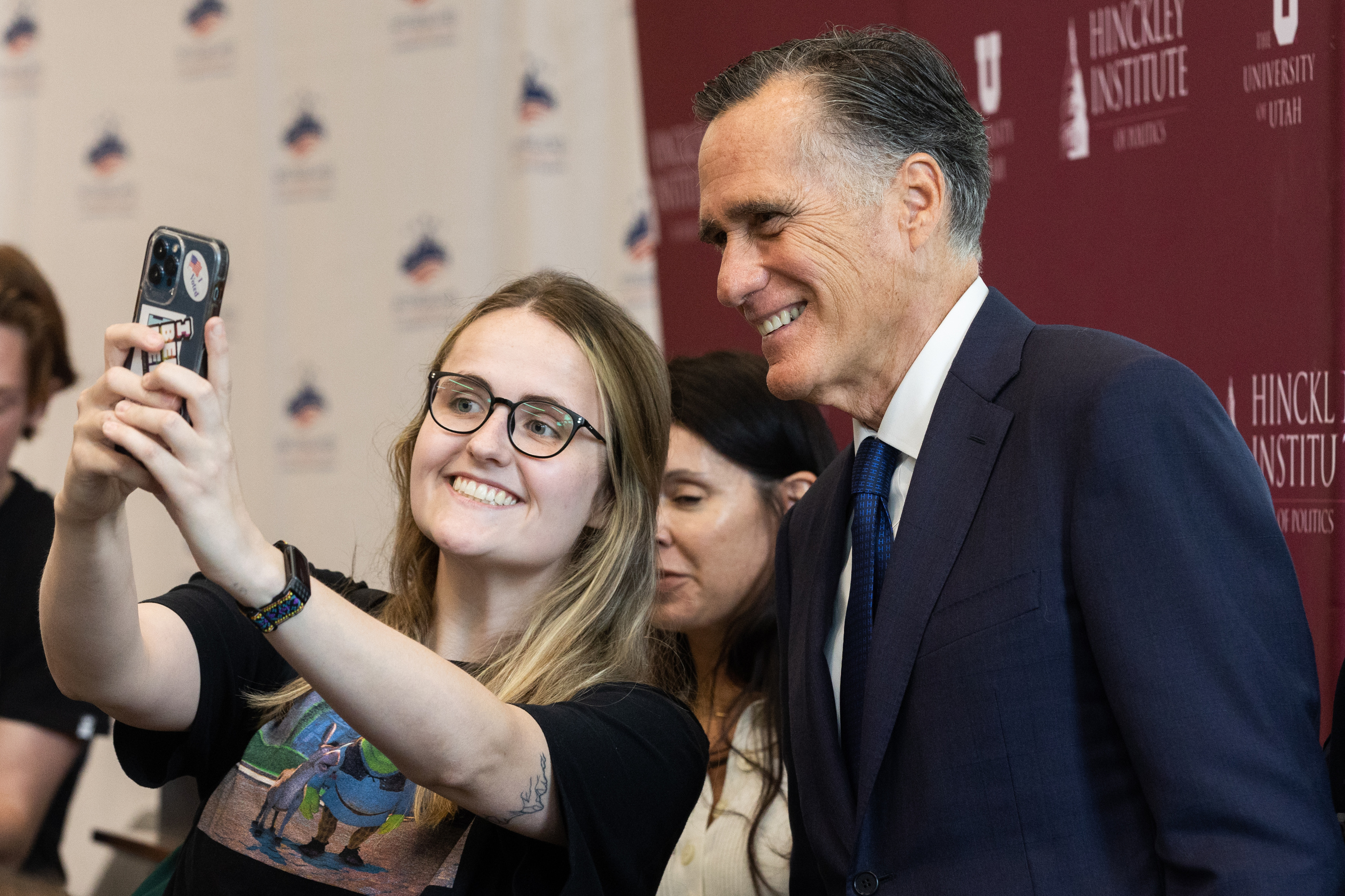 A student takes a selfie with Utah Sen. Mitt Romney at the Sutherland Institute's 2023 Congressional Series at the Hinckley Institute on the University of Utah campus in Salt Lake City on Monday, Aug. 21, 2023.