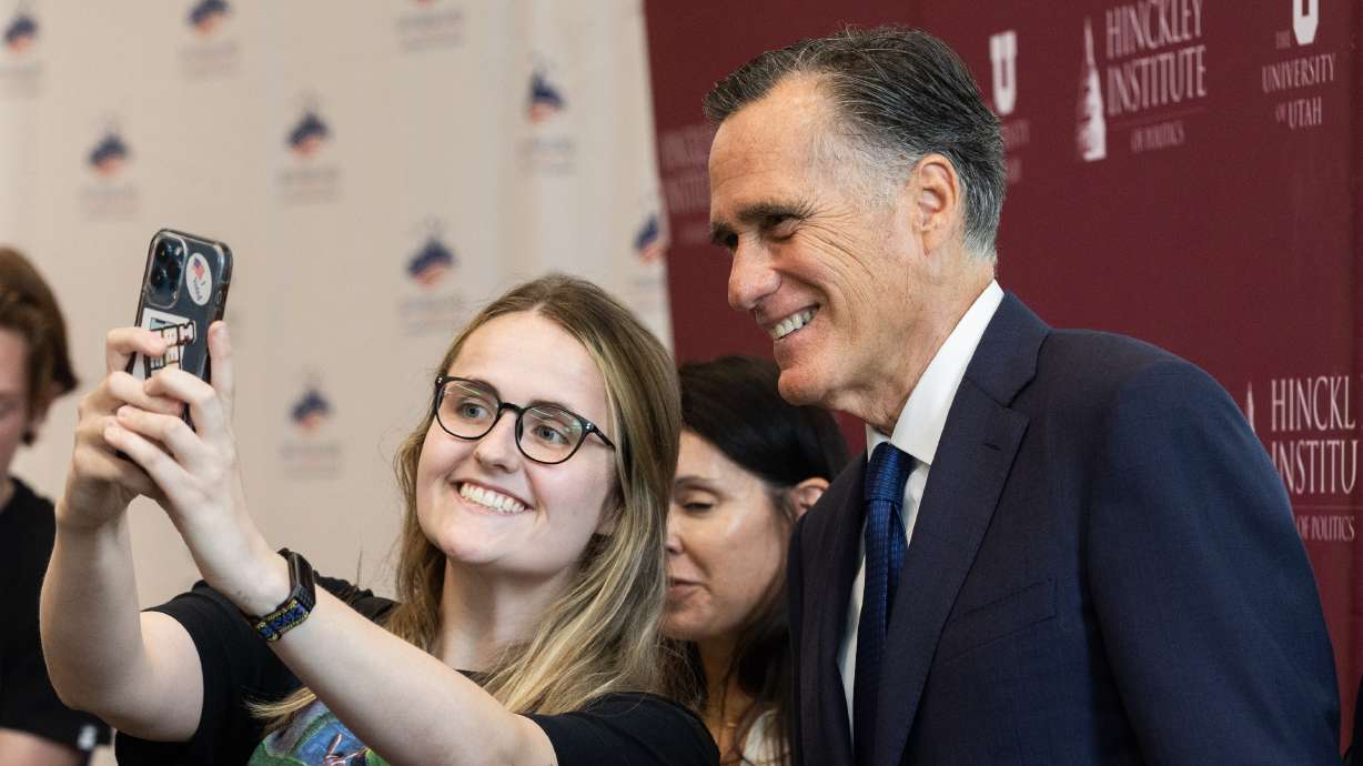 A student takes a selfie with Utah Sen. Mitt Romney at the Sutherland Institute's 2023 Congressional Series at the Hinckley Institute on the University of Utah campus in Salt Lake City on Monday, Aug. 21, 2023.