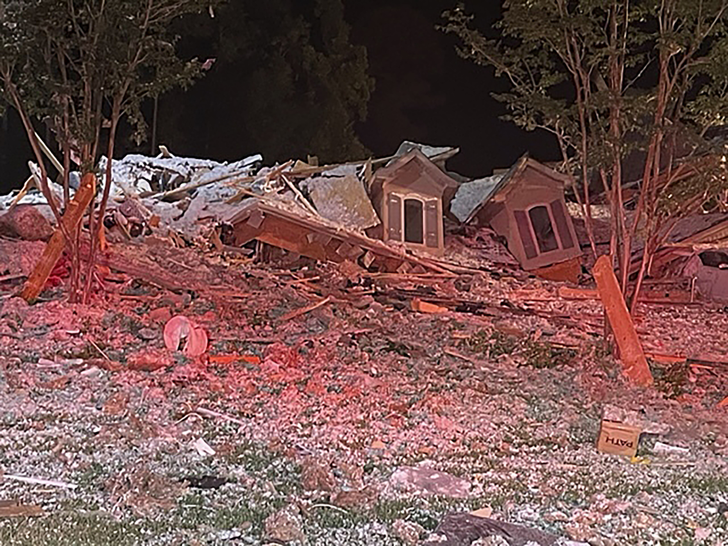 This photo provided by the Iredell County Fire Services and Emergency Management taken early Tuesday morning, Aug. 22, 2023, in Mooresville, N.C., shows the rubble of a home that collapsed. Iredell County Emergency Management said in a Tuesday news release that emergency officials responded to the home after a reported explosion and collapse and that one person was injured and another person was found dead in the debris. 