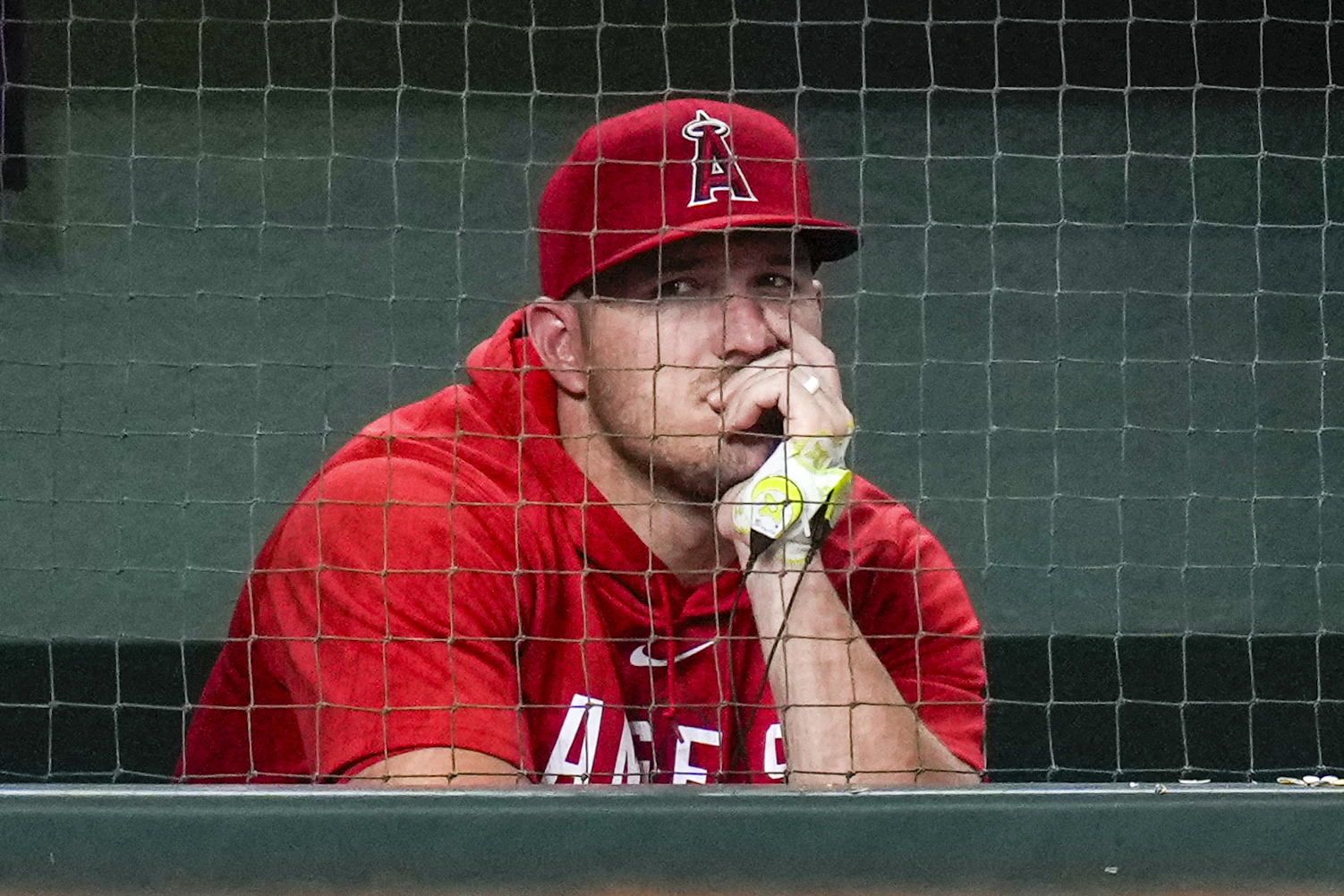 Los Angeles Angels' Mike Trout watches from the dugout during the ninth inning of the team's baseball game against the Houston Astros, Friday, Aug. 11, 2023, in Houston. 