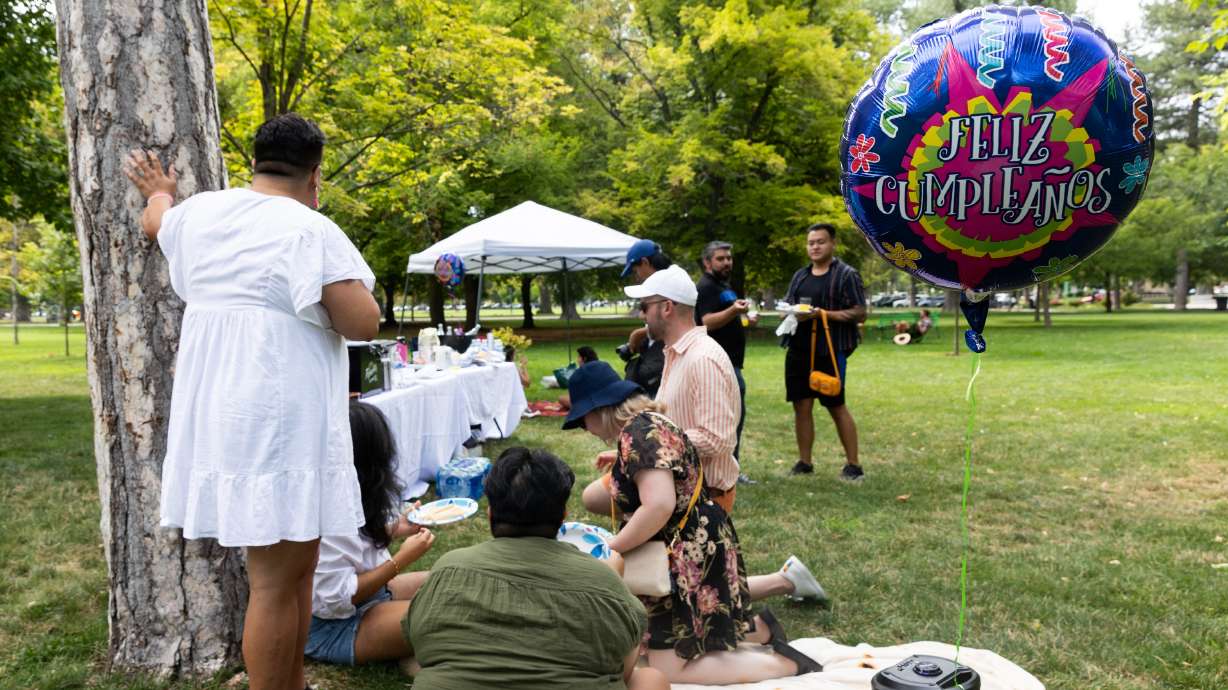 Members of Unidxs hang out at an event celebrating the two-year anniversary of Unidxs, which focuses on creating community for LGBTQ+ Latinos, at Liberty Park in Salt Lake City on Aug. 20.