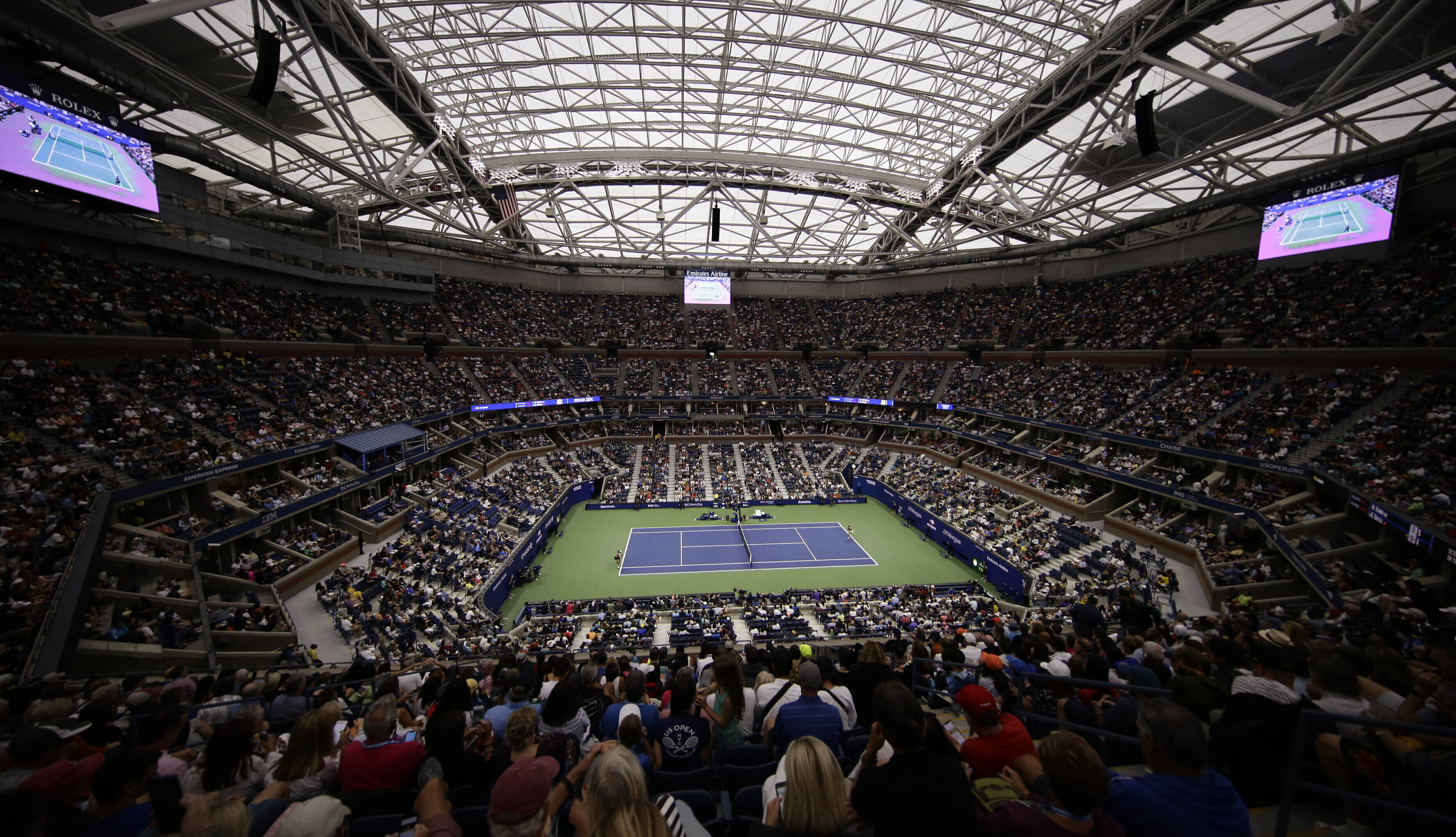 FILE - A fourth round match is played under the roof of Arthur Ashe Stadium during the U.S. Open tennis championships Monday, Sept. 2, 2019, in New York. Play at the 2023 U.S. Open begins at Flushing Meadows on Aug. 28, with Iga Swiatek and Carlos Alcaraz as the defending champions.