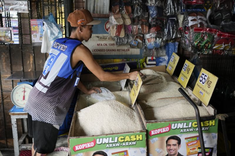 A vendor sells rice at a store in Quezon, Philippines, on Aug. 14. Countries worldwide are scrambling to secure rice after a partial ban on exports by India cut supplies by roughly a fifth.