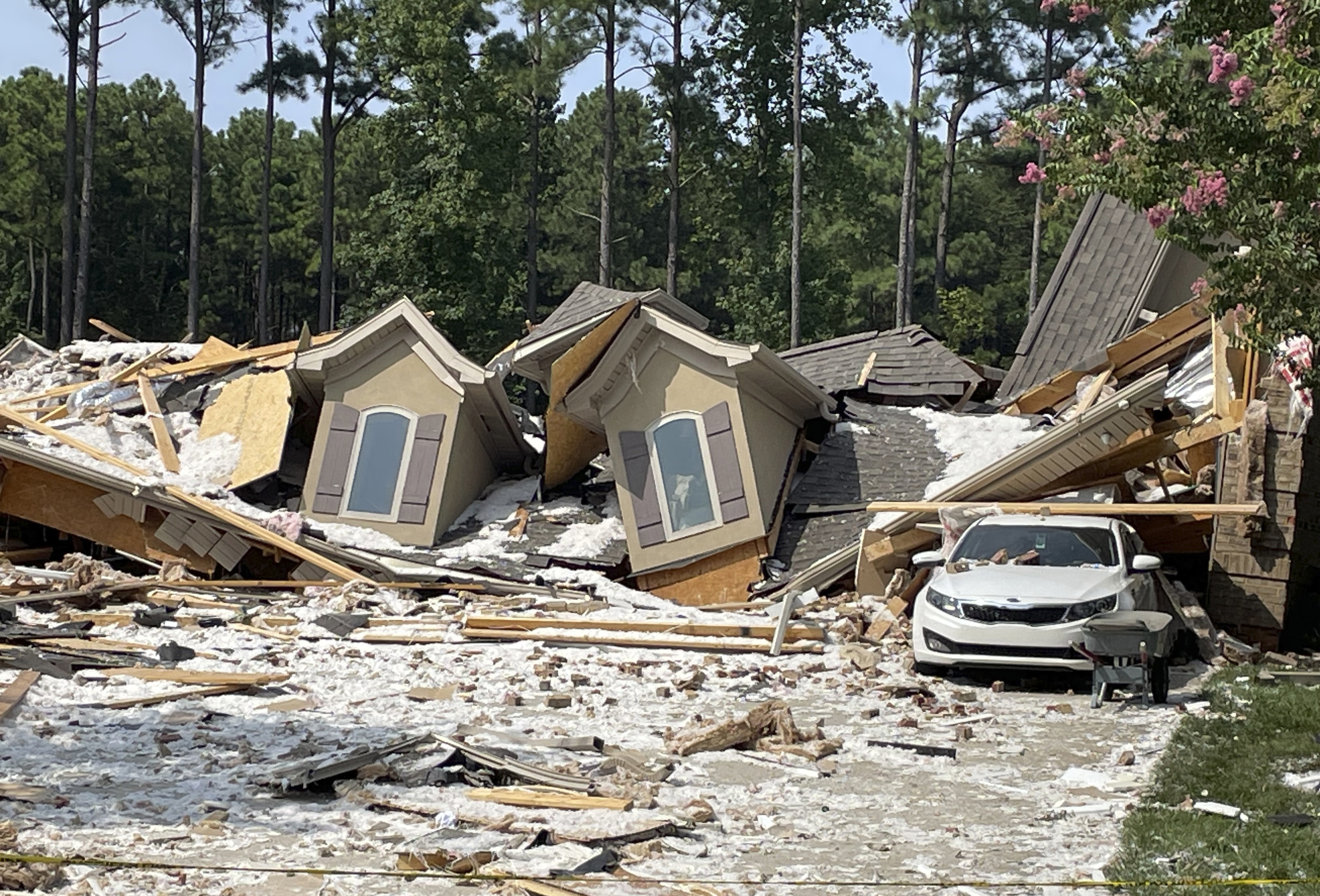 Damage and debris from a house explosion are seen in Mooresville, N.C., Tuesday, Aug. 22, 2023. Robert M. Farley, father of Tennessee Titans cornerback Caleb Farley, died overnight in the explosion that destroyed the NFL player's North Carolina home and left another person injured, authorities said.