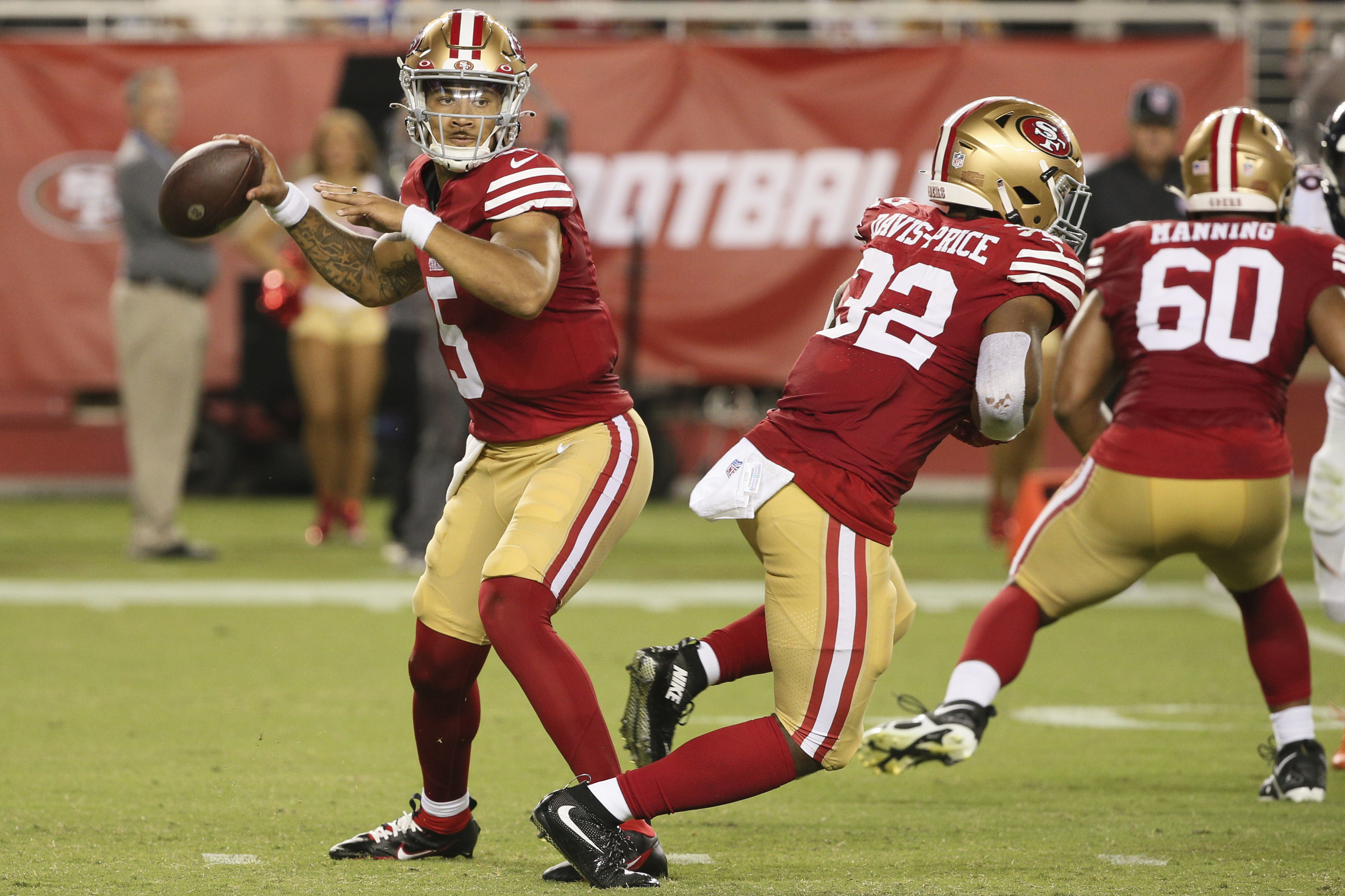San Francisco 49ers quarterback Trey Lance (5) looks for a receiver during the second half of the team's NFL football preseason game against the Denver Broncos on Saturday, Aug. 19, 2023, in Santa Clara, Calif. The 49ers won 21-20.
