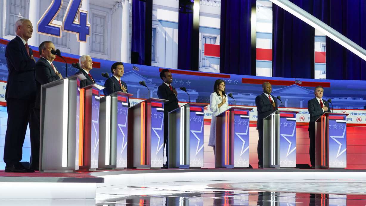 Republican presidential candidates, from left, Asa Hutchinson, Chris Christie, Mike Pence, Ron DeSantis, Vivek Ramaswamy, Nikki Haley, Tim Scott and Doug Burgum stand on stage before a Republican presidential primary debate Wednesday.