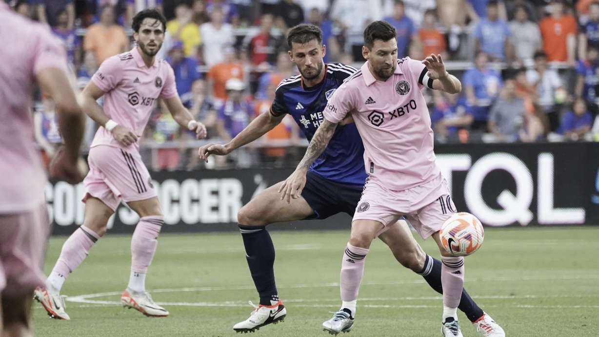 Inter Miami forward Lionel Messi, right, controls the ball next to FC Cincinnati defender Matt Miazga during the first half of a U.S. Open Cup soccer semifinal Wednesday, Aug. 23, 2023, in Cincinnati.