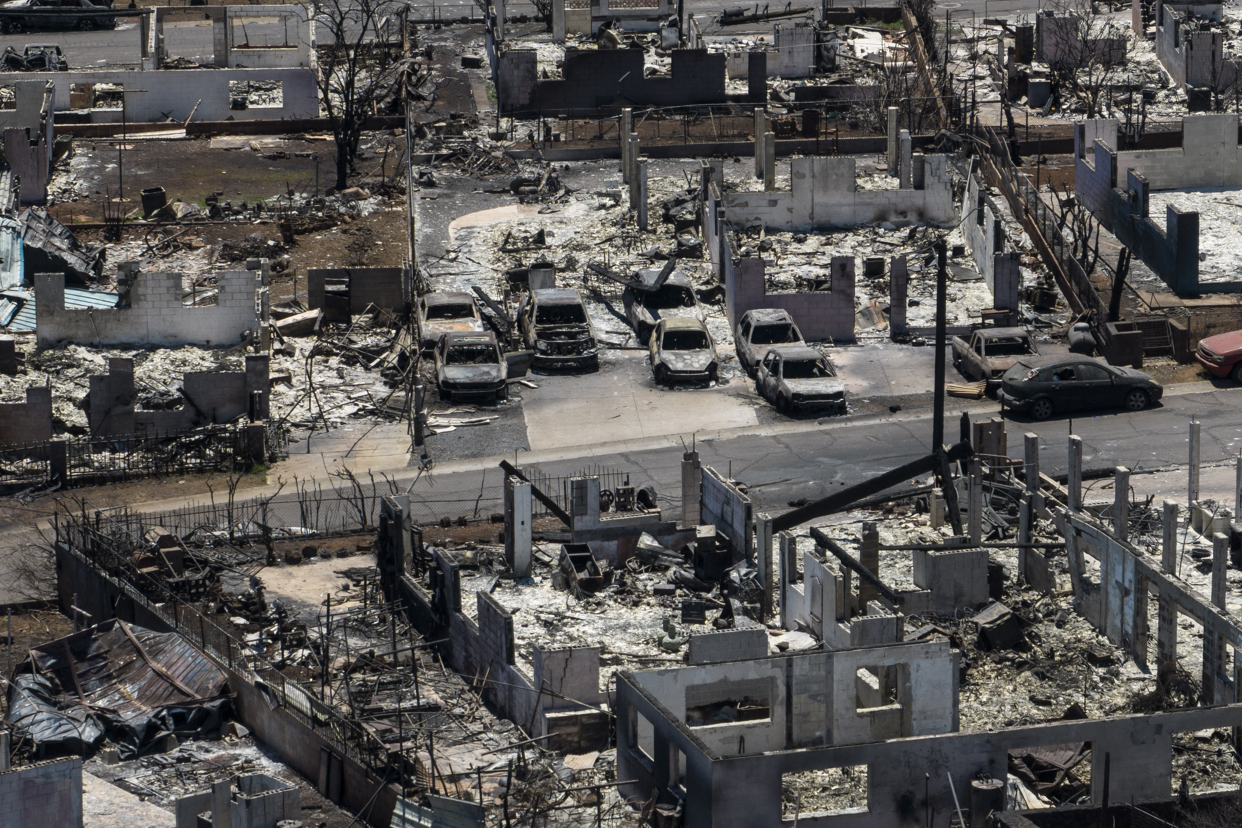 A general view shows the aftermath of a devastating wildfire in Lahaina, Hawaii, Tuesday. Two weeks after the deadliest U.S. wildfire in more than a century, Maui County has sued Hawaiian Electric Company over the fires that devastated the community, saying the utility negligently failed to shut off power despite exceptionally high winds and dry conditions.