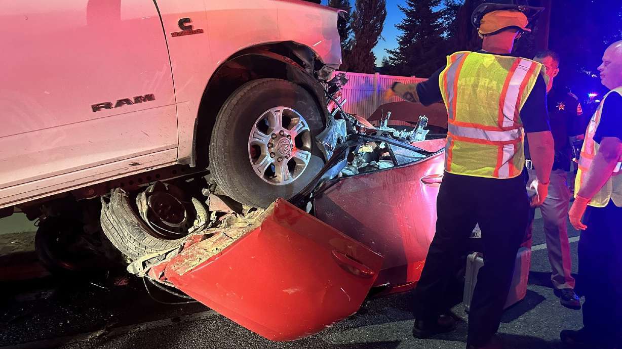 The driver of a pickup truck who police say caused a horrific head-on crash on Highland Drive on Aug. 16 that left a woman trapped in her vehicle for nearly an hour, was charged on Thursday.