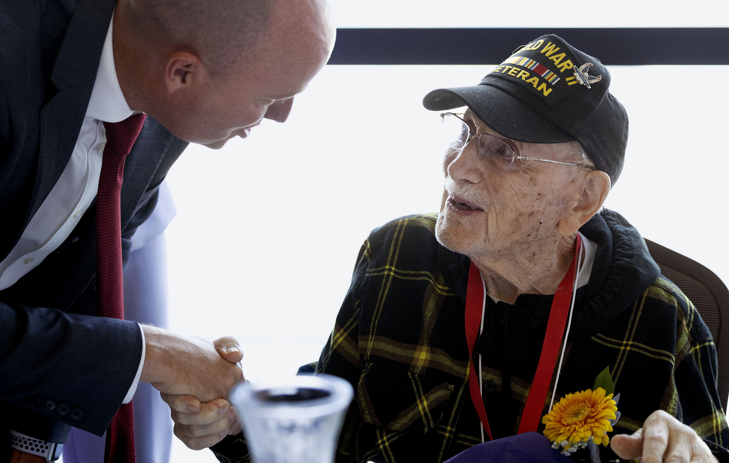 Gov. Spencer Cox speaks with 103-year-old World War II veteran Eugene Hecker. Salt Lake County held a regional solutions event regarding "Aging in Place" in West Jordan on Wednesday. 