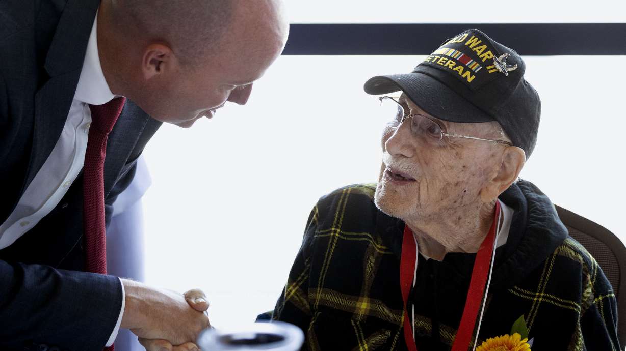 Gov. Spencer Cox speaks with 103-year-old World War II veteran Eugene Hecker. Salt Lake County held a regional solutions event regarding "Aging in Place" in West Jordan on Wednesday.