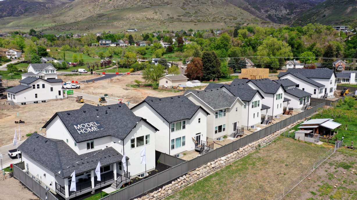 Single-family houses are pictured in theROSE community in Farmington on May 8. Rising interest rates make buying new home even less affordable.