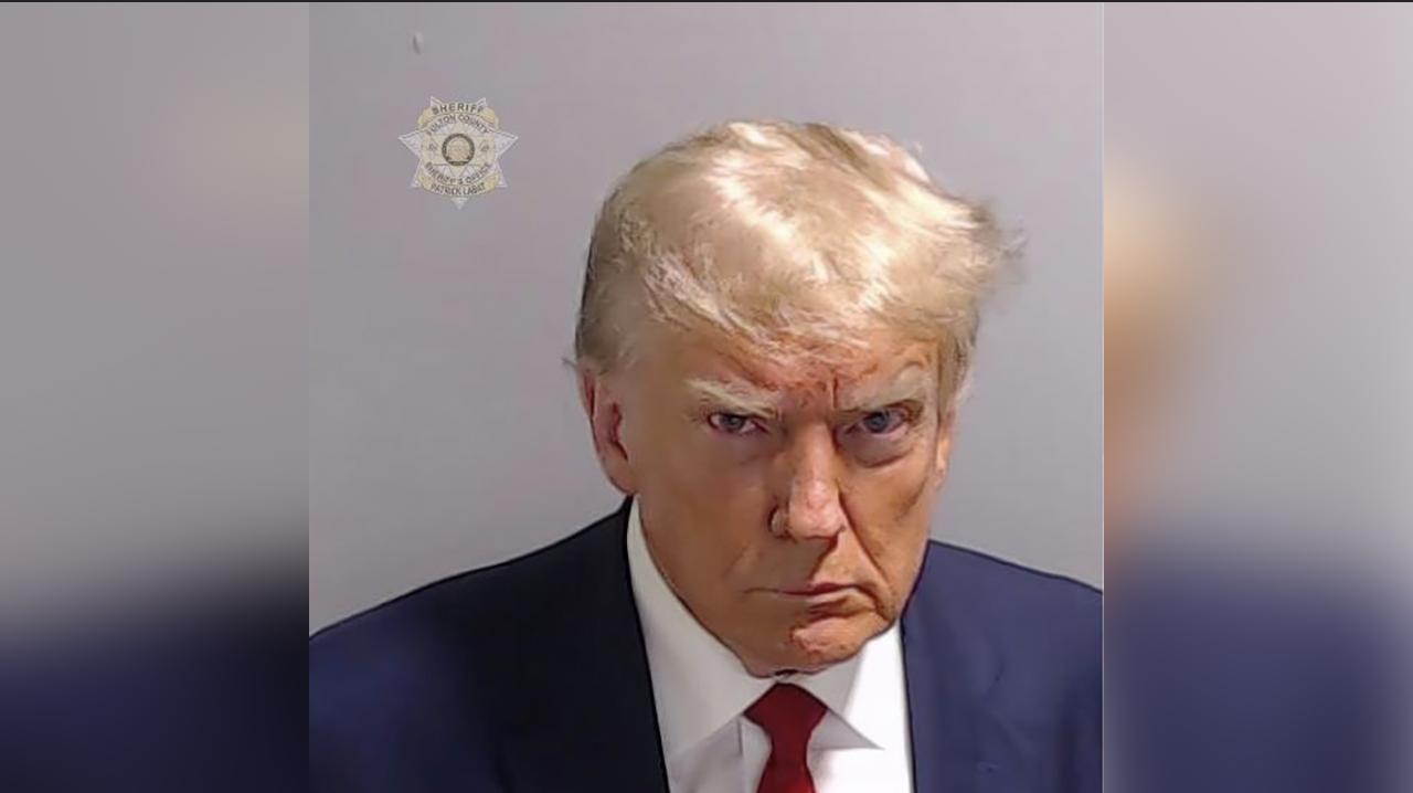 This booking photo provided by Fulton County Sheriff's Office, shows former President Donald Trump on Thursday after he surrendered and was booked at the Fulton County Jail in Atlanta. Trump is accused by District Attorney Fani Willis of scheming to subvert the will of Georgia voters in a desperate bid to keep Joe Biden out of the White House.