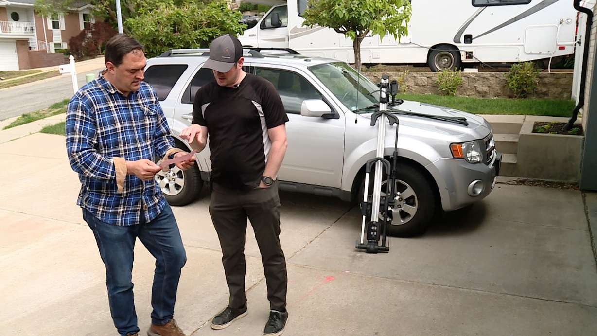 Dallin Pedersen shows KSL’s Matt Gephardt an incident report an employee at the car wash filled out, saying the top retract wasn’t set by the cashier. Pedersen believes the missed step led to the damage to his car.