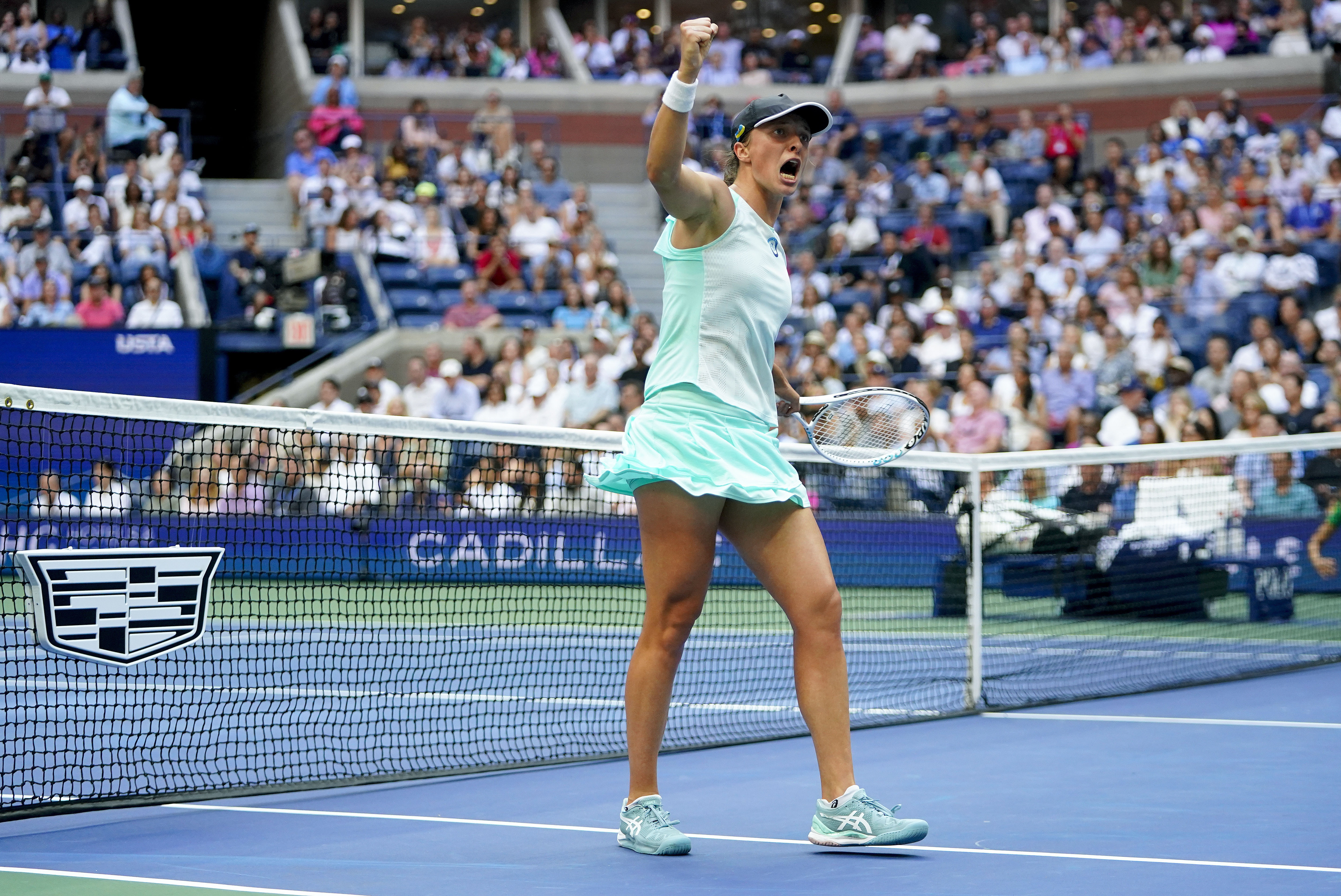 FILE - Iga Swiatek, of Poland, reacts after a point against Ons Jabeur, of Tunisia, during the women’s singles final of the U.S. Open tennis championships, Sept. 10, 2022, in New York. Swiatek won last year's title in New York and she tells the AP as the tournament is about to begin again that she does not want to focus on her final result. 