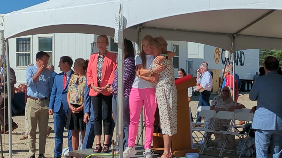 Christena Huntsman Durham hugs another ceremony attendee. The Huntsman family is one of the groups who helped pay for Salt Lake County's new Crisis Care Center.