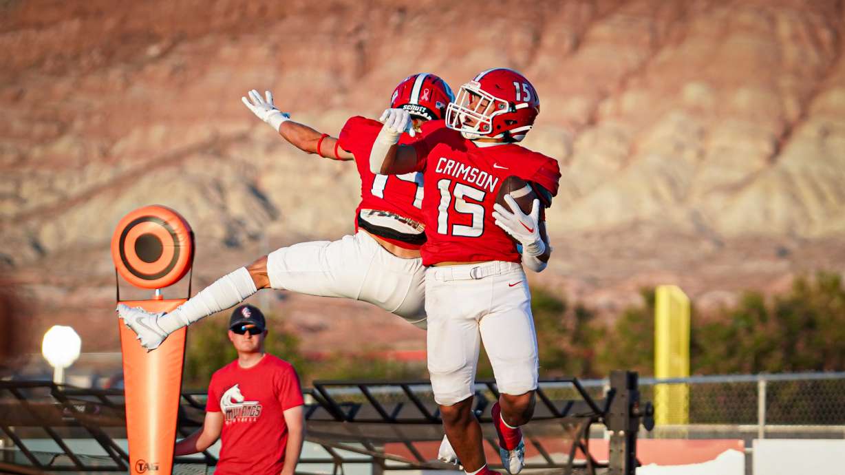Crimson Cliffs players celebrate after scoring a touchdown against Springville.