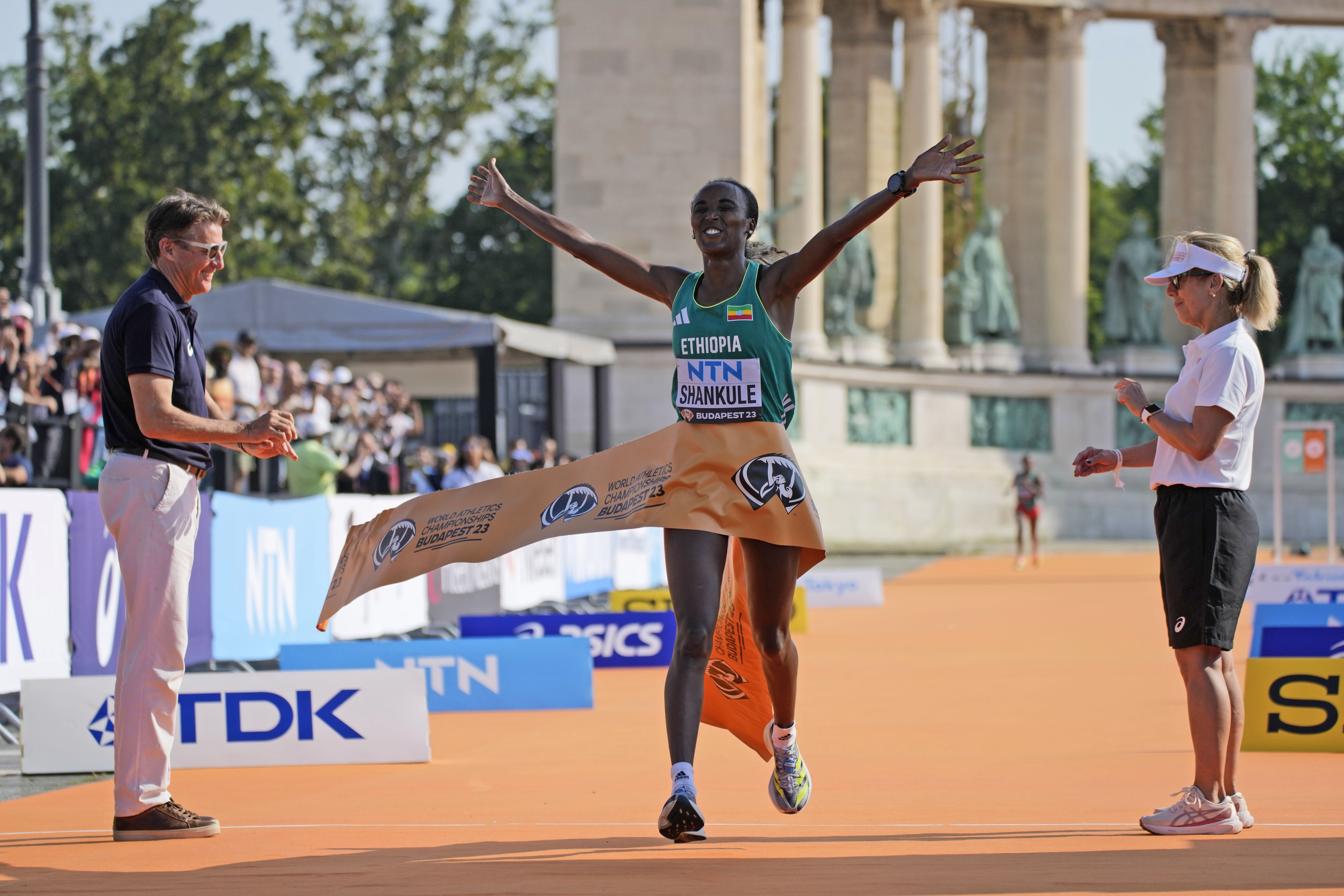 Amane Beriso Shankule of Ethiopia reacts as she crosses the finish line to win the women's marathon during the World Athletics Championships in Budapest, Hungary, Saturday, Aug. 26, 2023. 