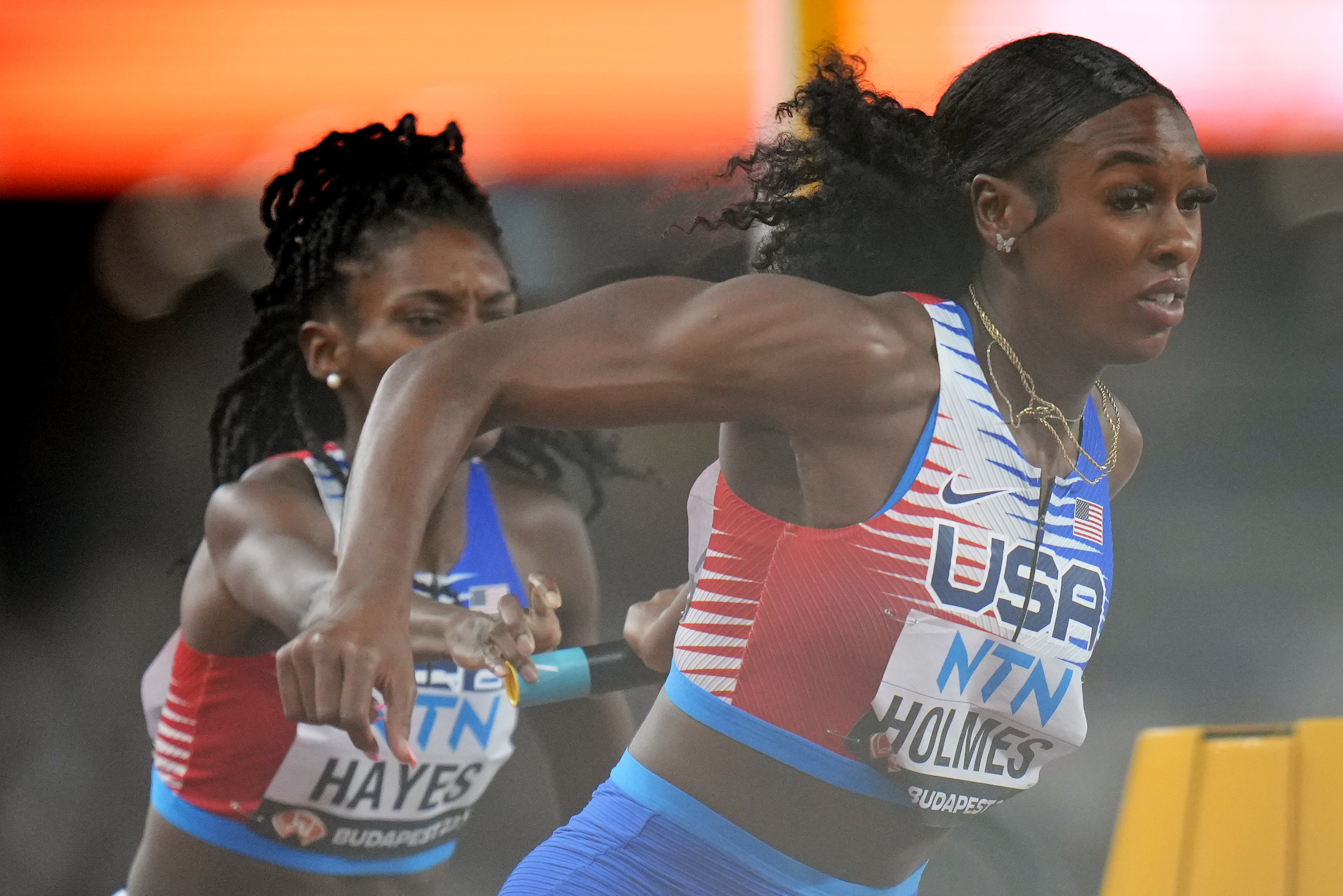 Alexis Holmes and Quanera Hayes, of the United States fail to make the final baton handover in a Women's 4x400-meters relay heat during the World Athletics Championships in Budapest, Hungary, Saturday, Aug. 26, 2023. The US team were disqualified for this.