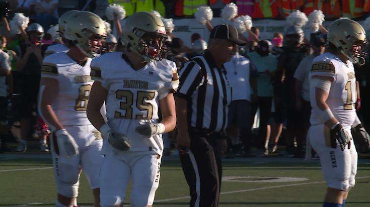 Jarom Parker, No. 35, starts in his Davis High school football game in Clearfield on Friday, less than a week after his father died.