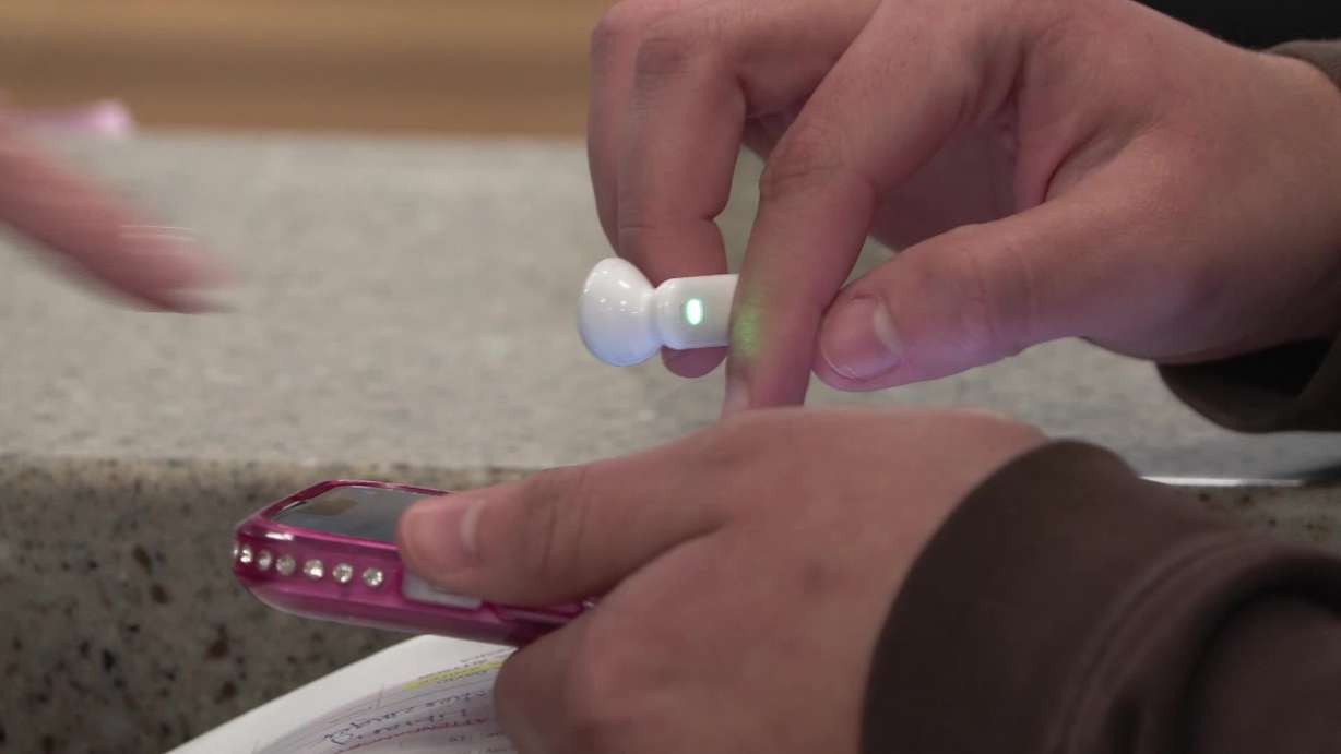 The Timekettle Translator earbuds are being used by students like Rianyelis.