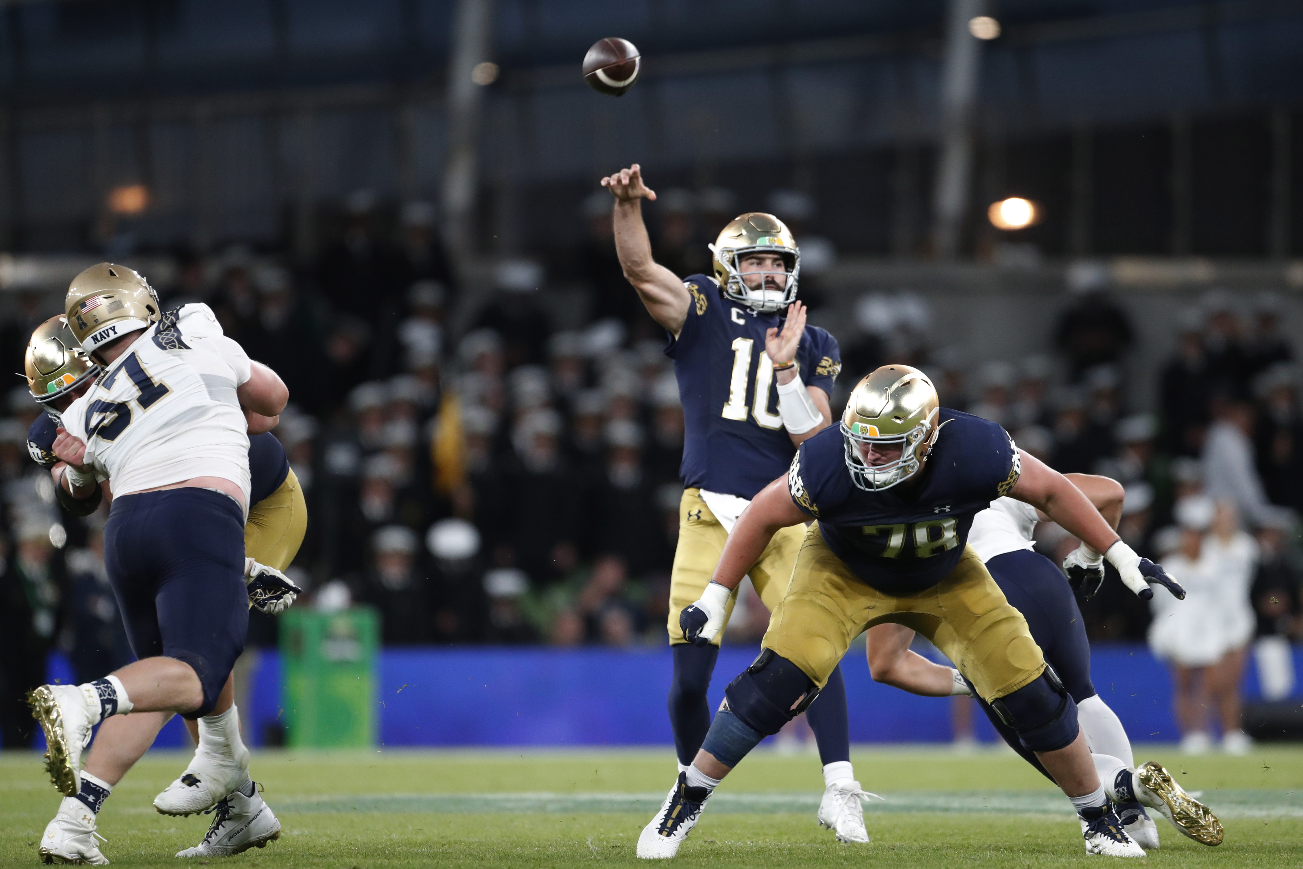 Notre Dame quarterback Sam Hartman (10) throws against Navy during an NCAA college football game in Dublin, Ireland, Aug. 26, 2023. 