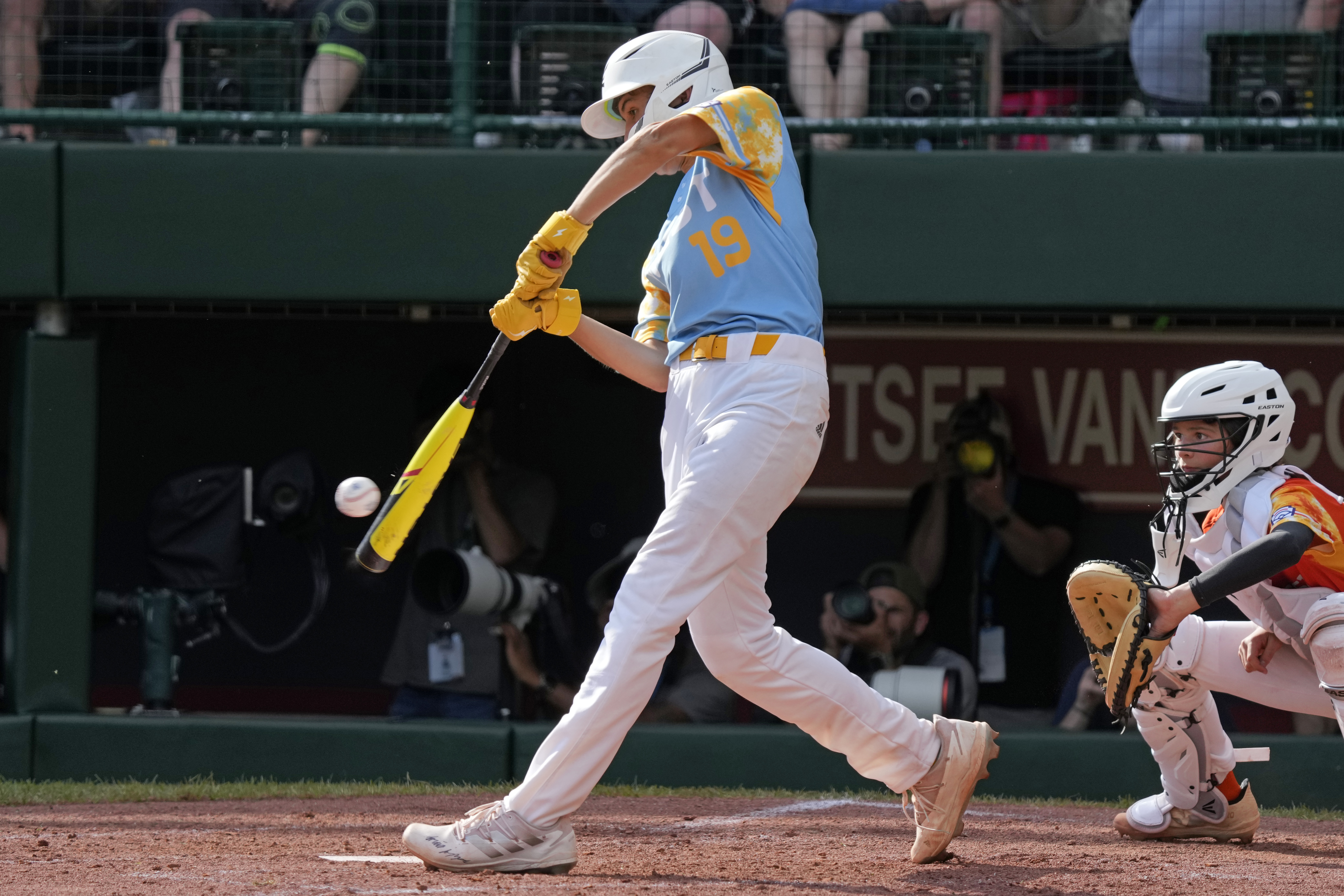 El Segundo, Calif.'s Louis Lappe hits a double off Needville, Texas' DJ Jablonski, driving in two runs, during the third inning of the United States Championship baseball game at the Little League World Series tournament in South Williamsport, Pa., Saturday, Aug. 26, 2023.