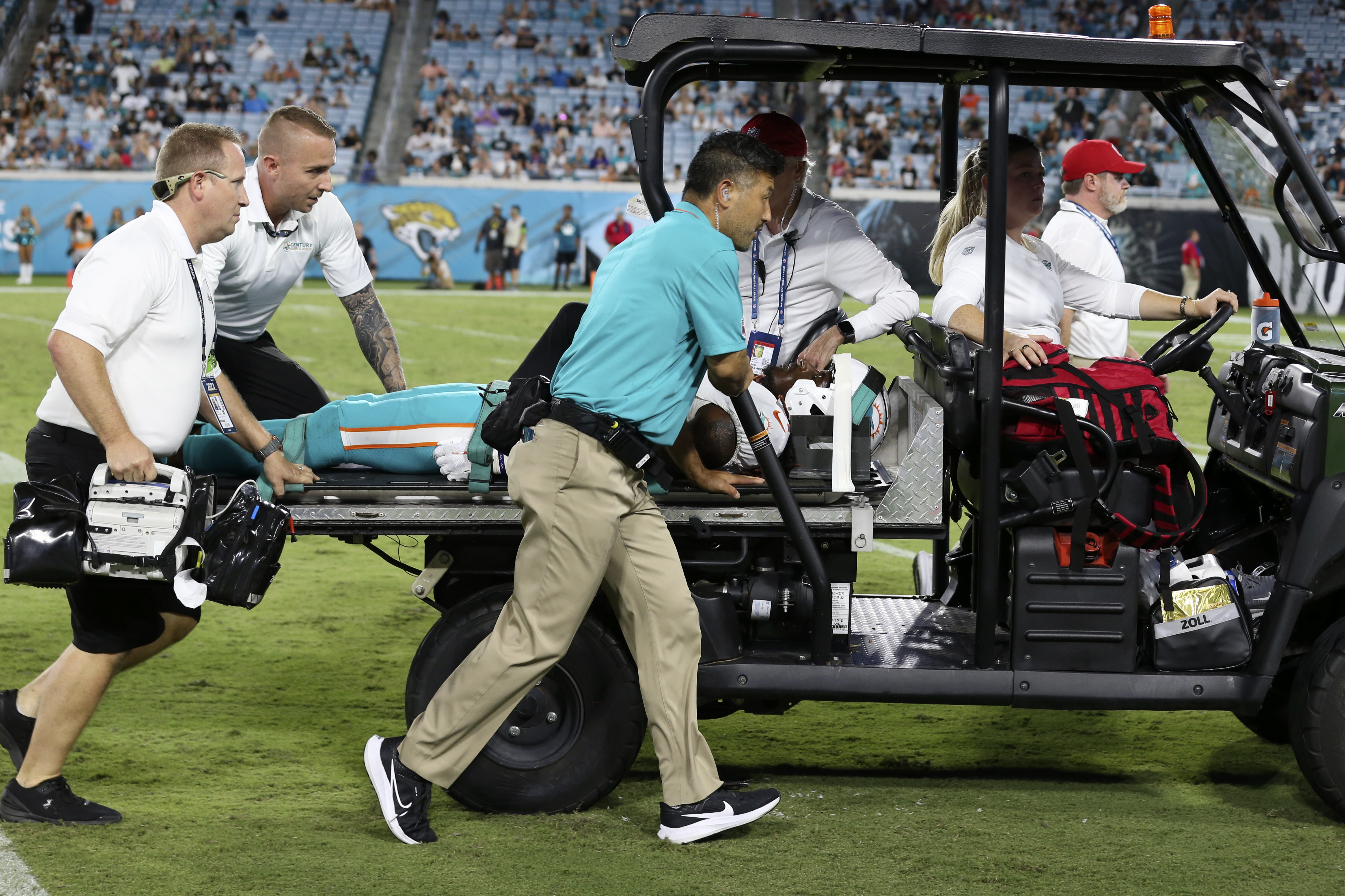 Miami Dolphins wide receiver Daewood Davis is carted off the field during the second half of an NFL preseason football game against the Jacksonville Jaguars, Saturday, Aug. 26, 2023, in Jacksonville, Fla.