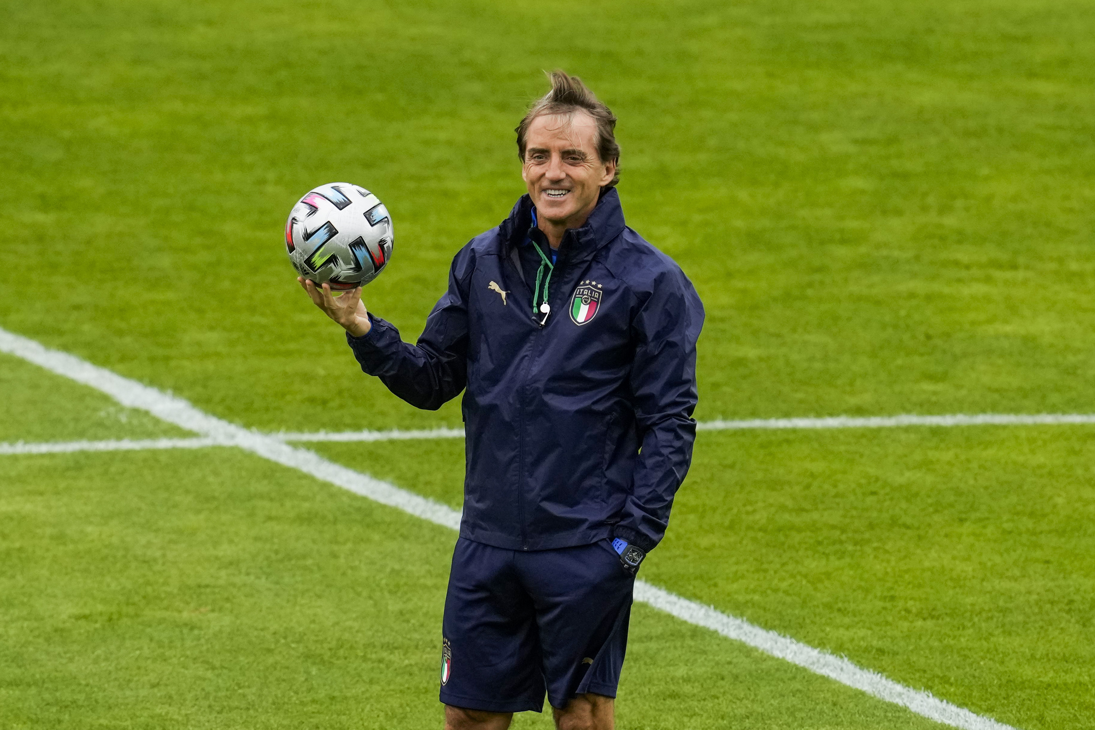 FILE - Italy's manager Roberto Mancini smiles during a training session at the Hive stadium in London, England, on July 5, 2021. Italy coach Roberto Mancini resigned surprisingly on Sunday, Aug. 13, 2023, ending an an up-and-down tenure with the national team that included a European Championship title in 2021 but also a failed qualification for last year’s World Cup.