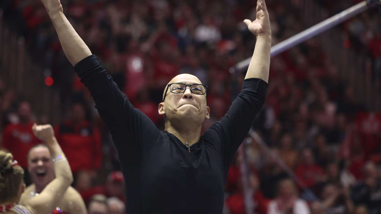 Utah’s gymnastics coach Tom Farden gets the crowd excited at the Huntsman Center in Salt Lake City on Feb. 3. Former gymnasts and parents allege Farden verbally and emotionally abused athletes; others defend the coach.
